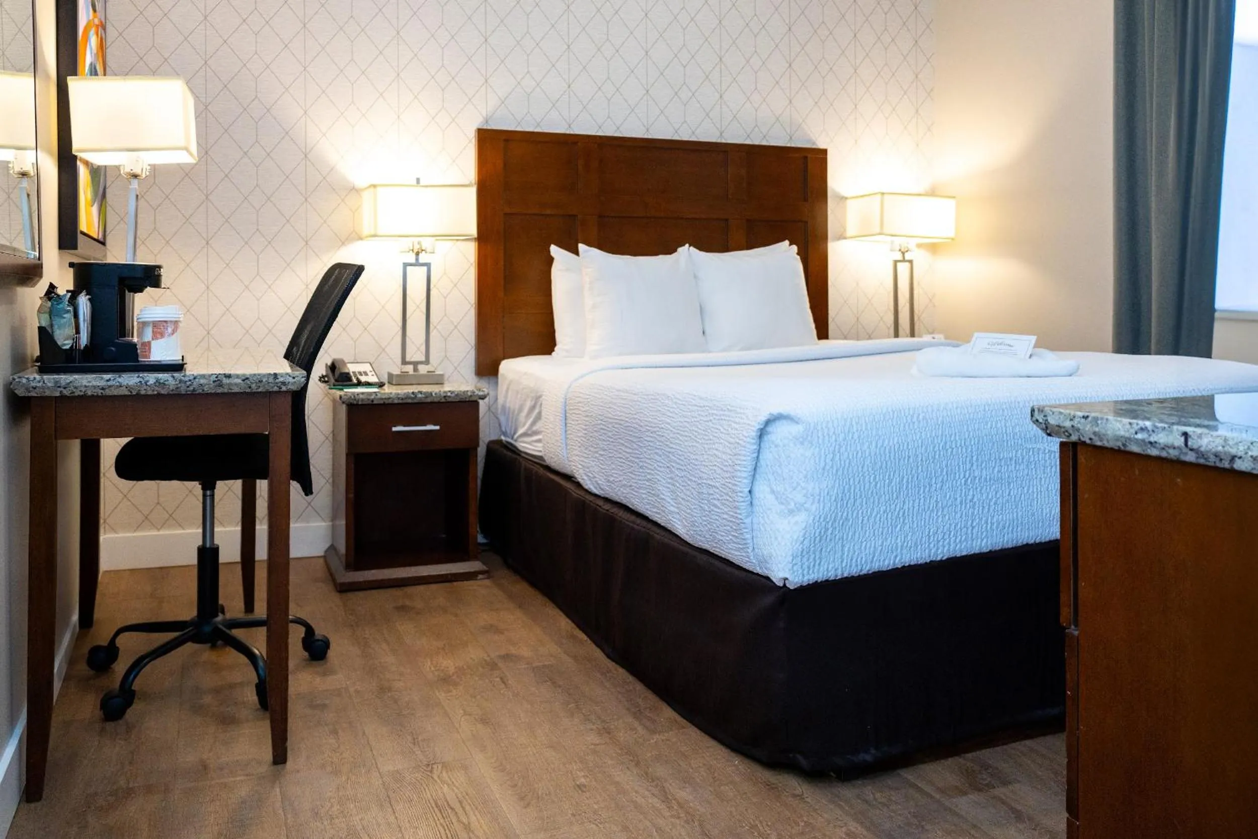 Bed in Quality Inn & Suites