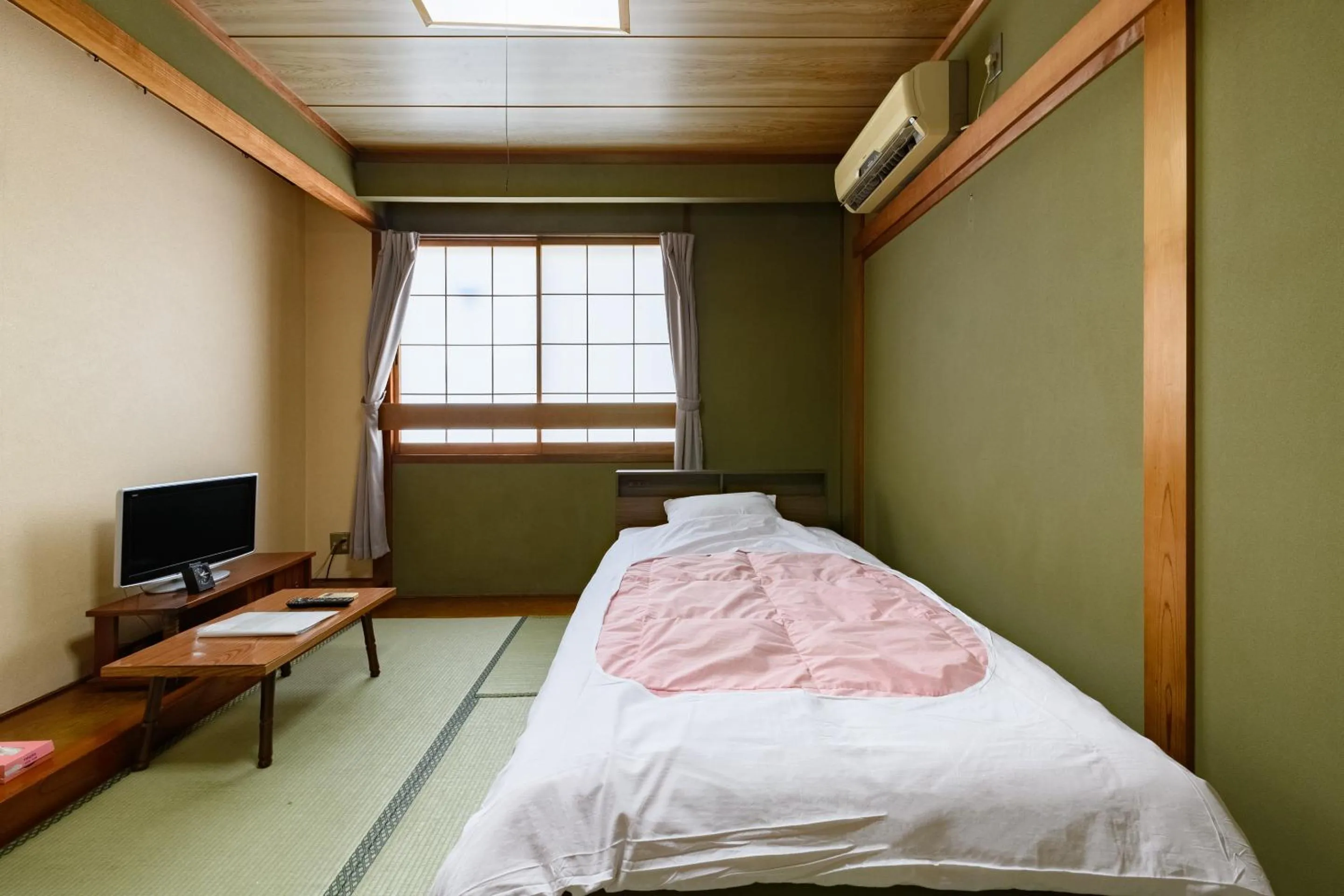 Bed in Tabist HotelNakajima Fuji