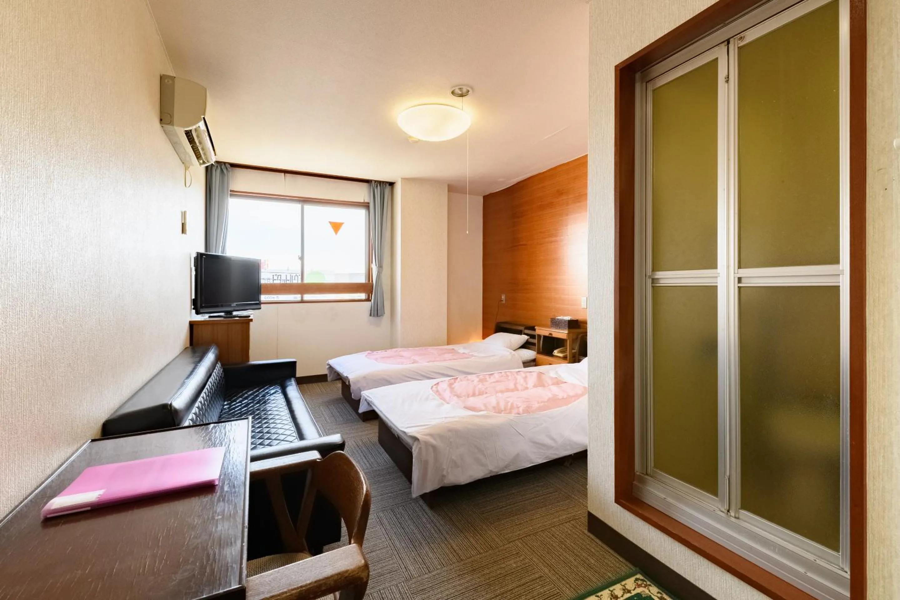 Bed in Tabist HotelNakajima Fuji