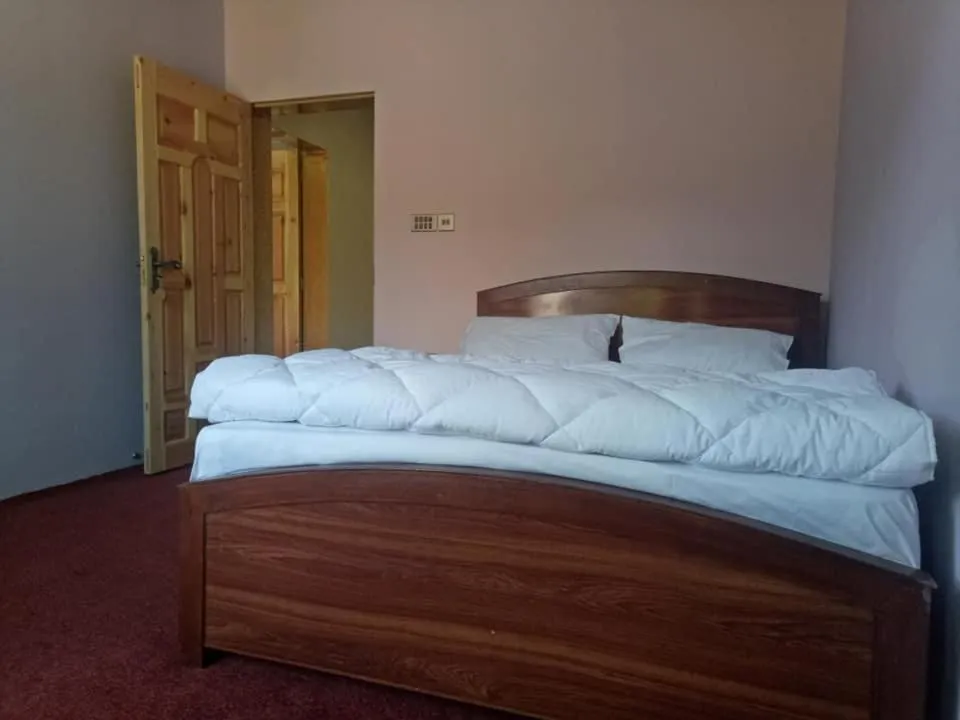 Bed in MasakAli Family Guest House