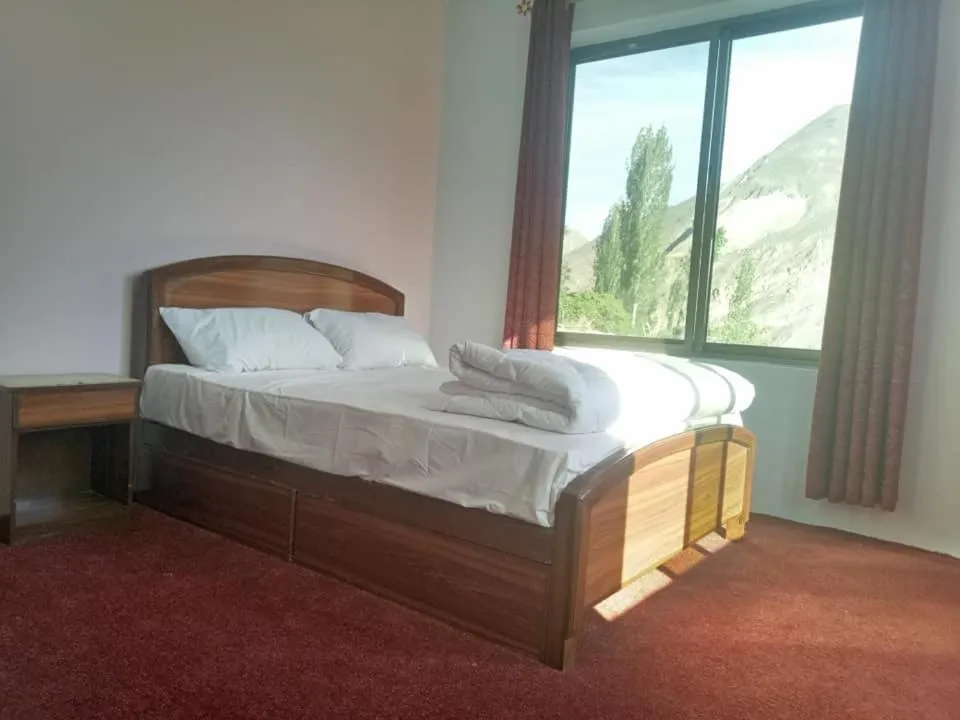 Bed in MasakAli Family Guest House