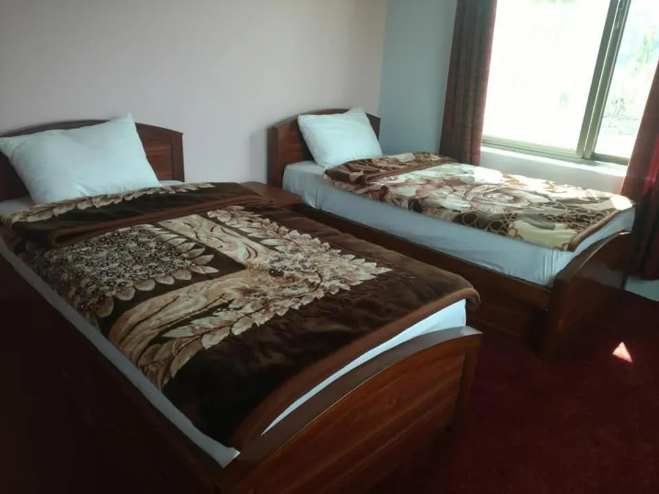 Bed in MasakAli Family Guest House