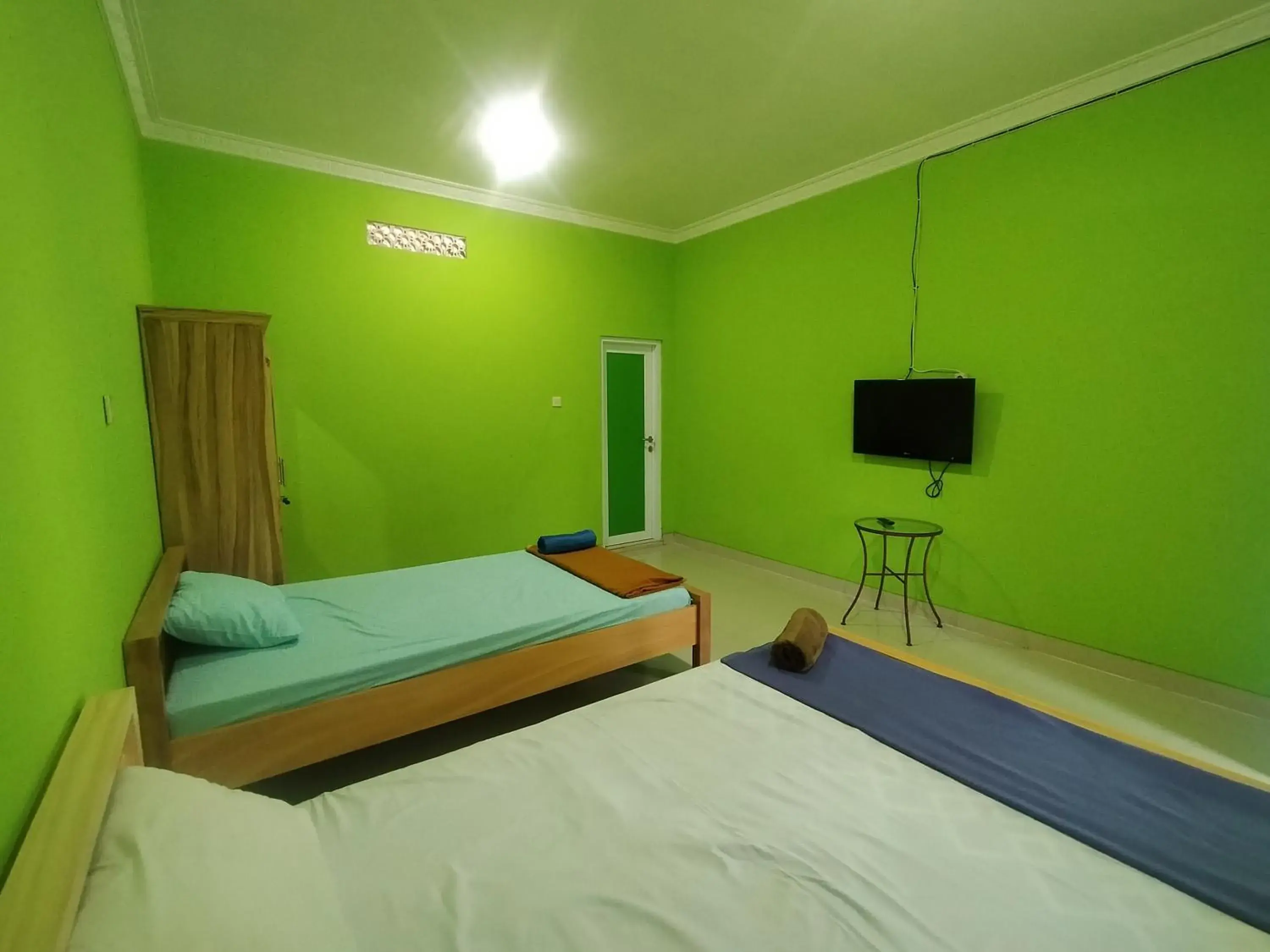 Bed in Villa Batu Tua Puncak Mitra RedDoorz Bed in Villa Batu Tua Puncak Mitra RedDoorz