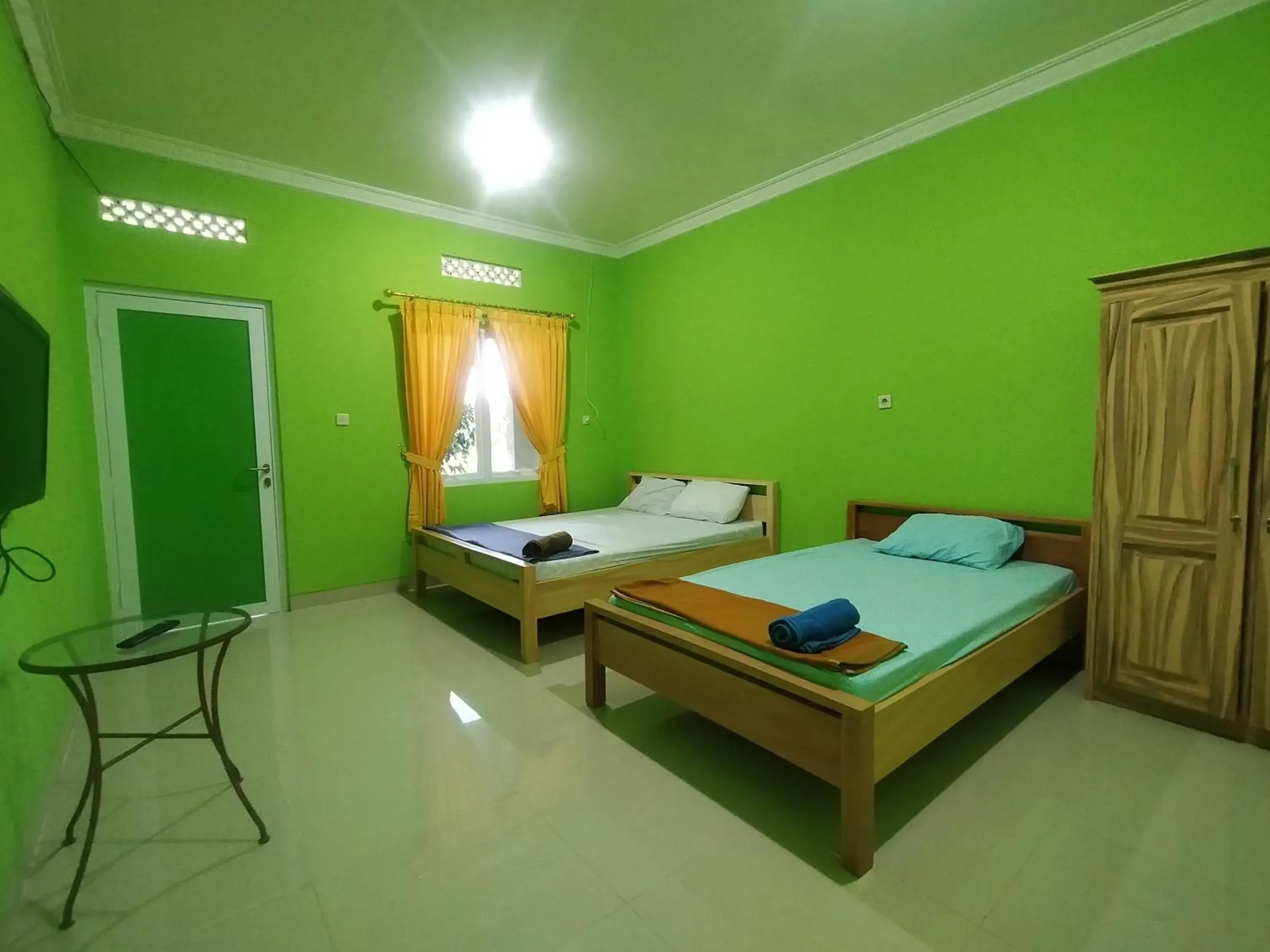 Bed in Villa Batu Tua Puncak Mitra RedDoorz Bed in Villa Batu Tua Puncak Mitra RedDoorz