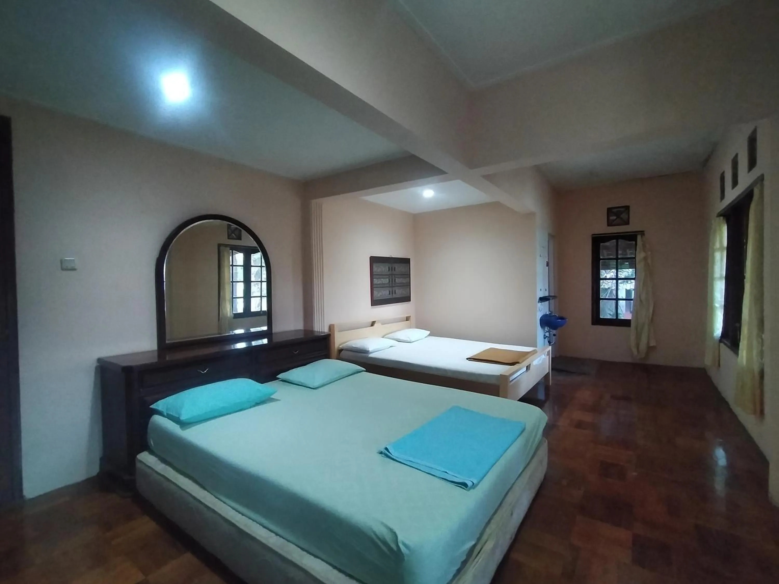 Bed in Villa Batu Tua Puncak Mitra RedDoorz