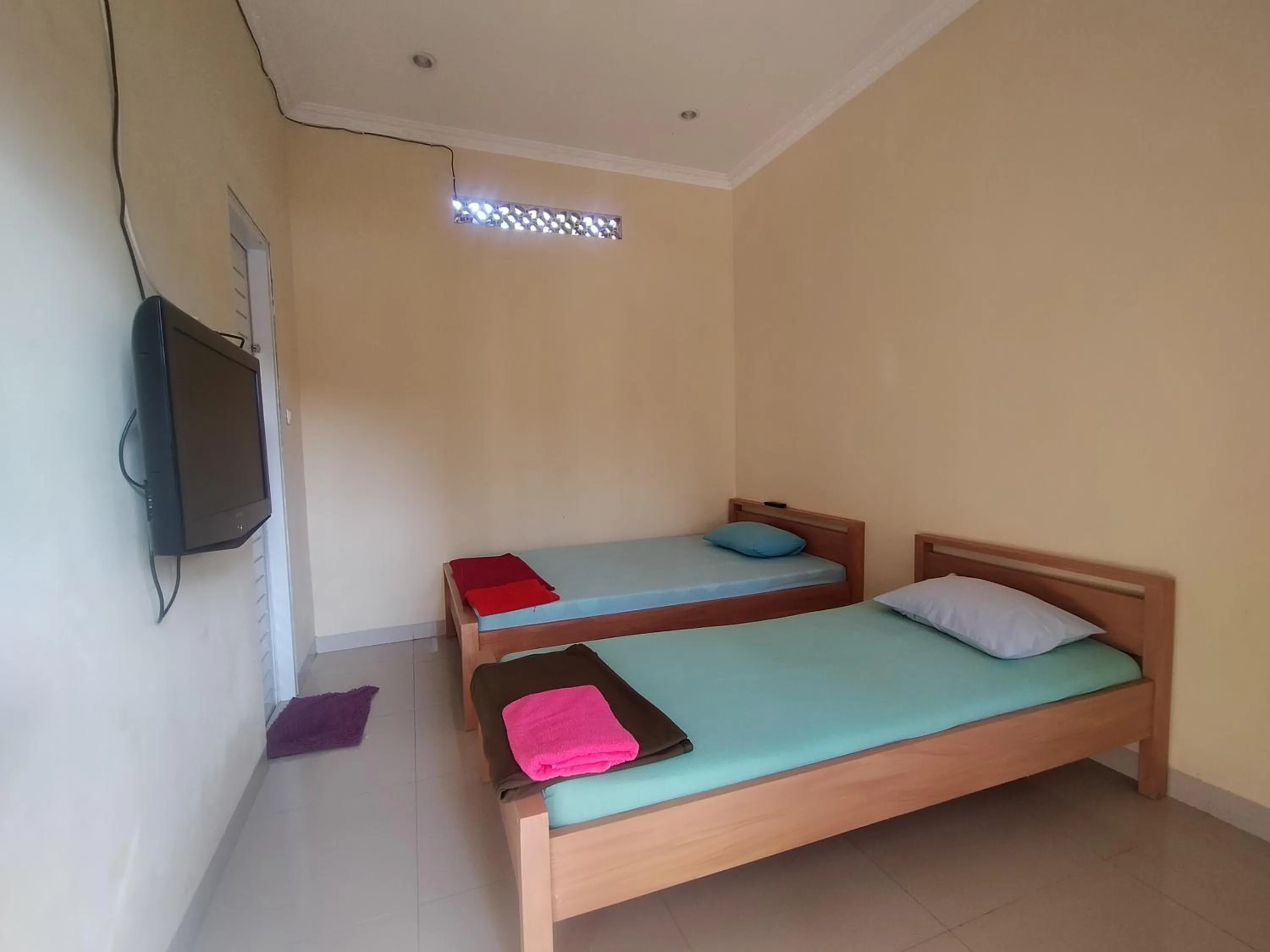 Bed in Villa Batu Tua Puncak Mitra RedDoorz