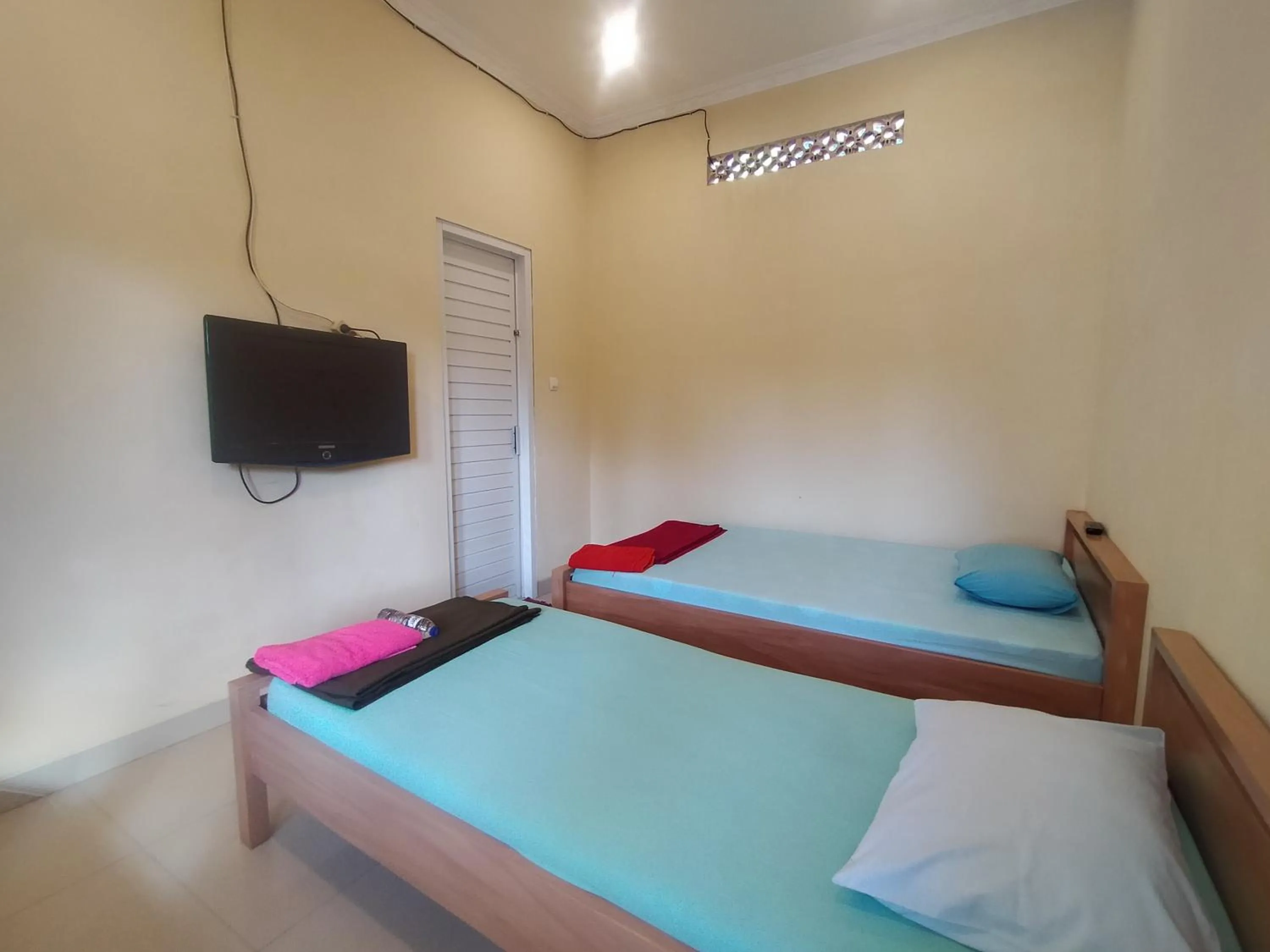 Bed in Villa Batu Tua Puncak Mitra RedDoorz