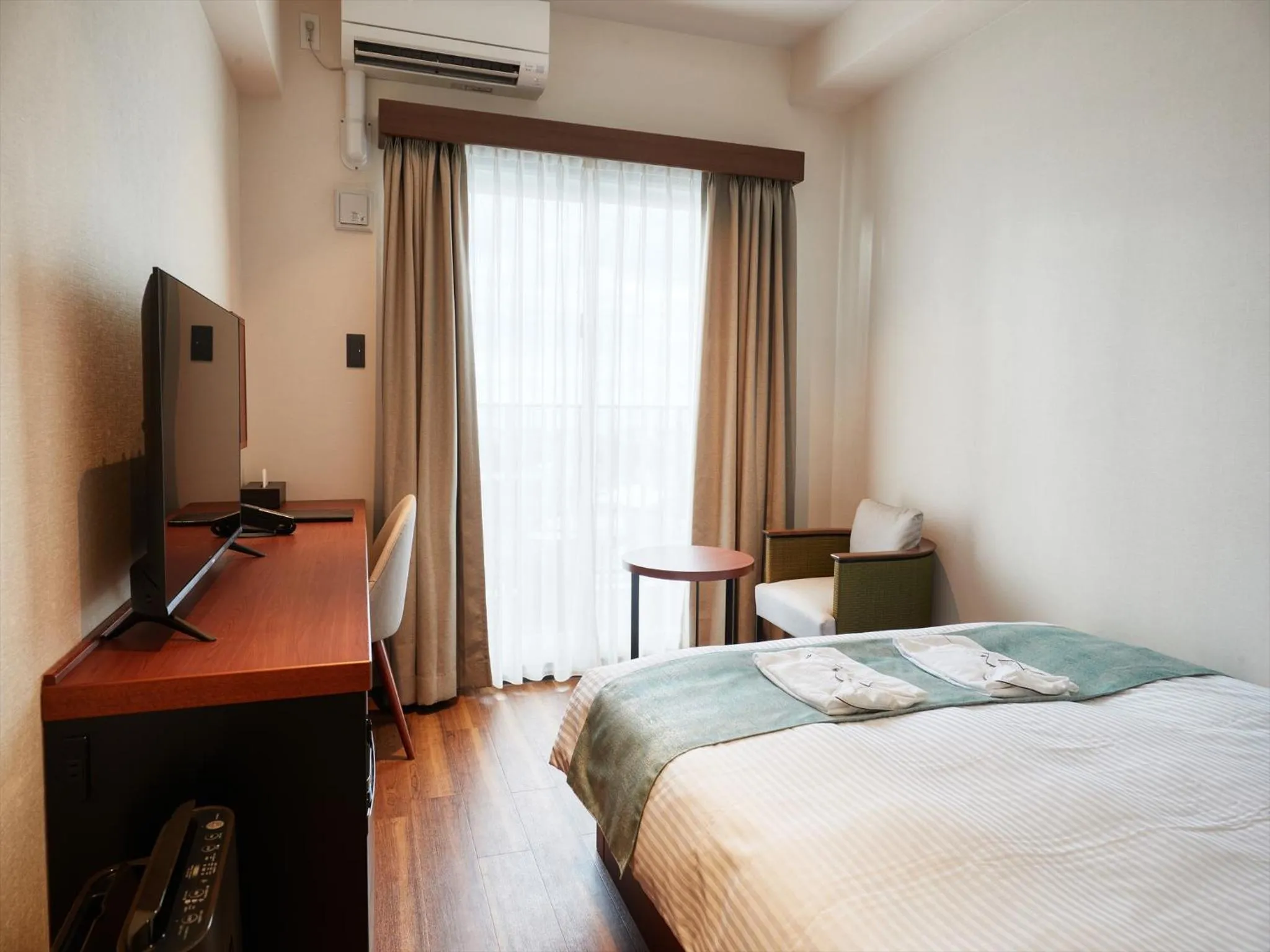 Photo of the whole room, Bed in THE GRAND HOTEL GINOWAN