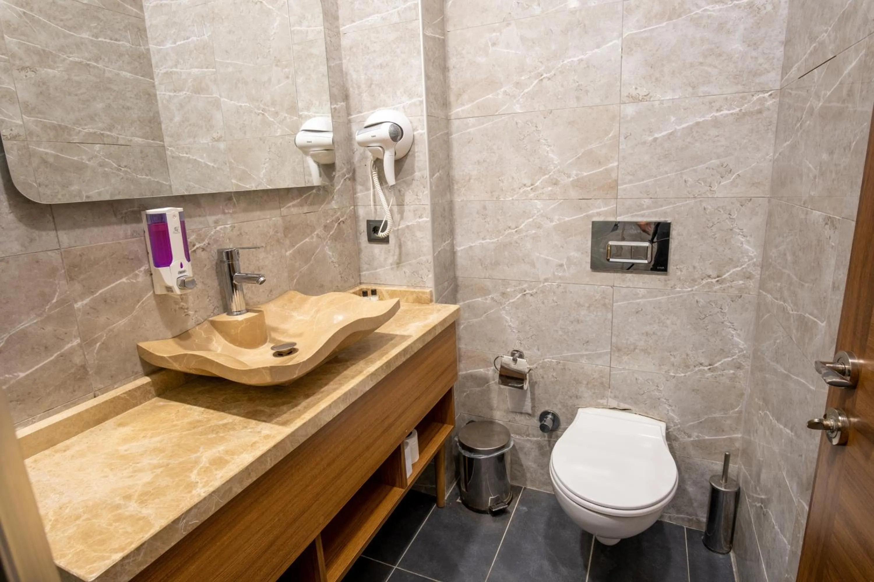 Toilet in Orange Hotel & Spa