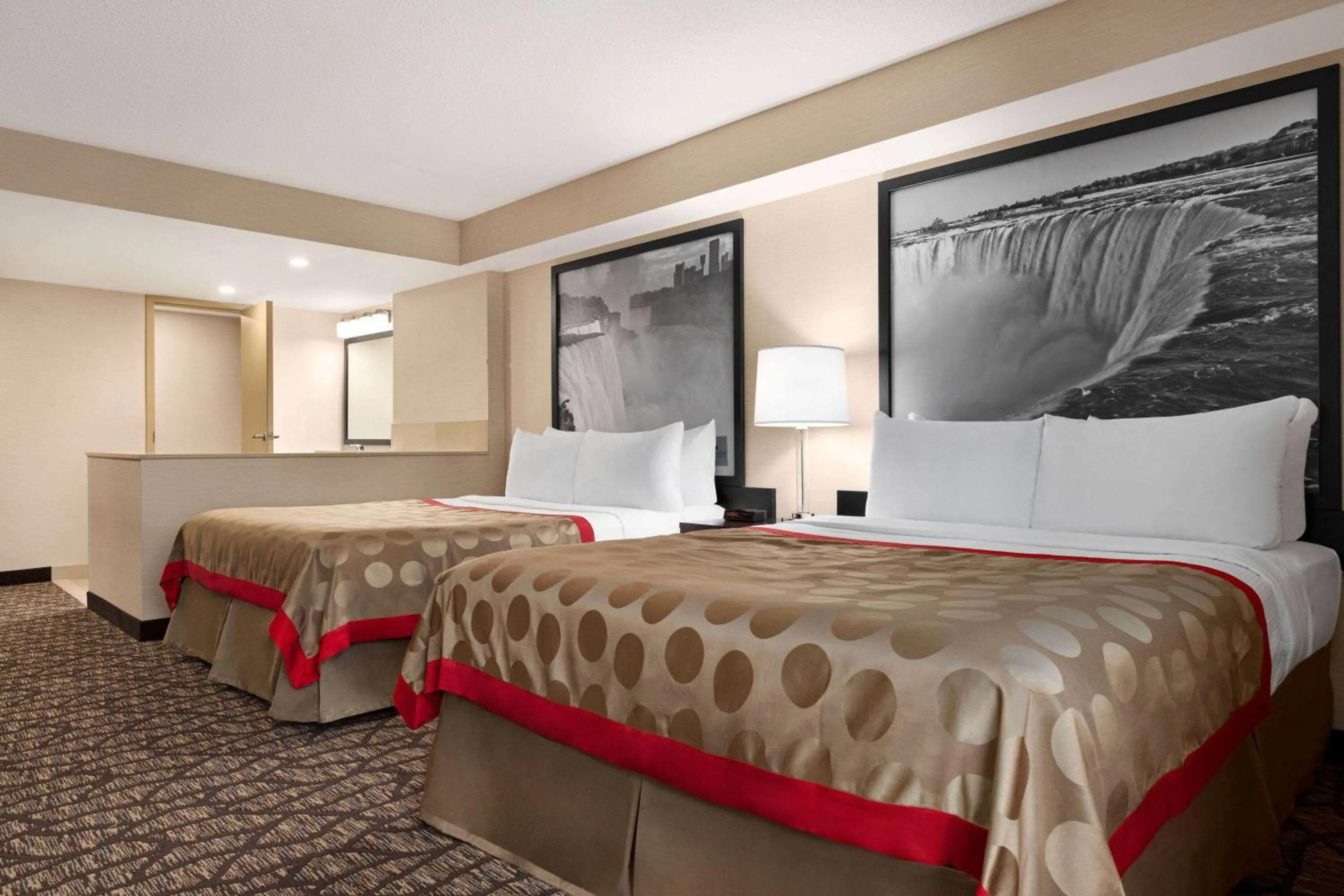 Photo of the whole room, Bed in Ramada By Wyndham Niagara Falls near the Falls