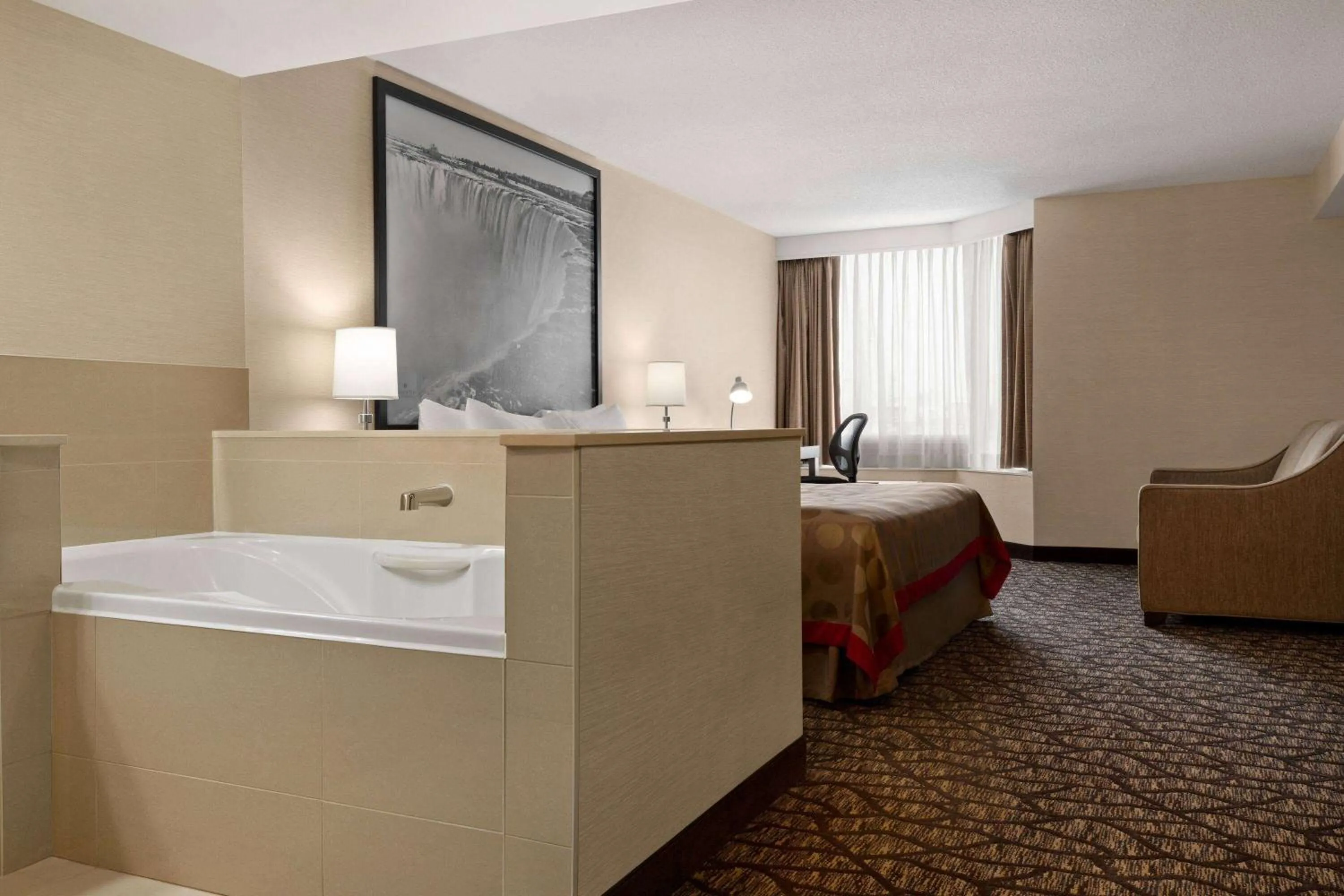 Photo of the whole room, Bed in Ramada By Wyndham Niagara Falls near the Falls