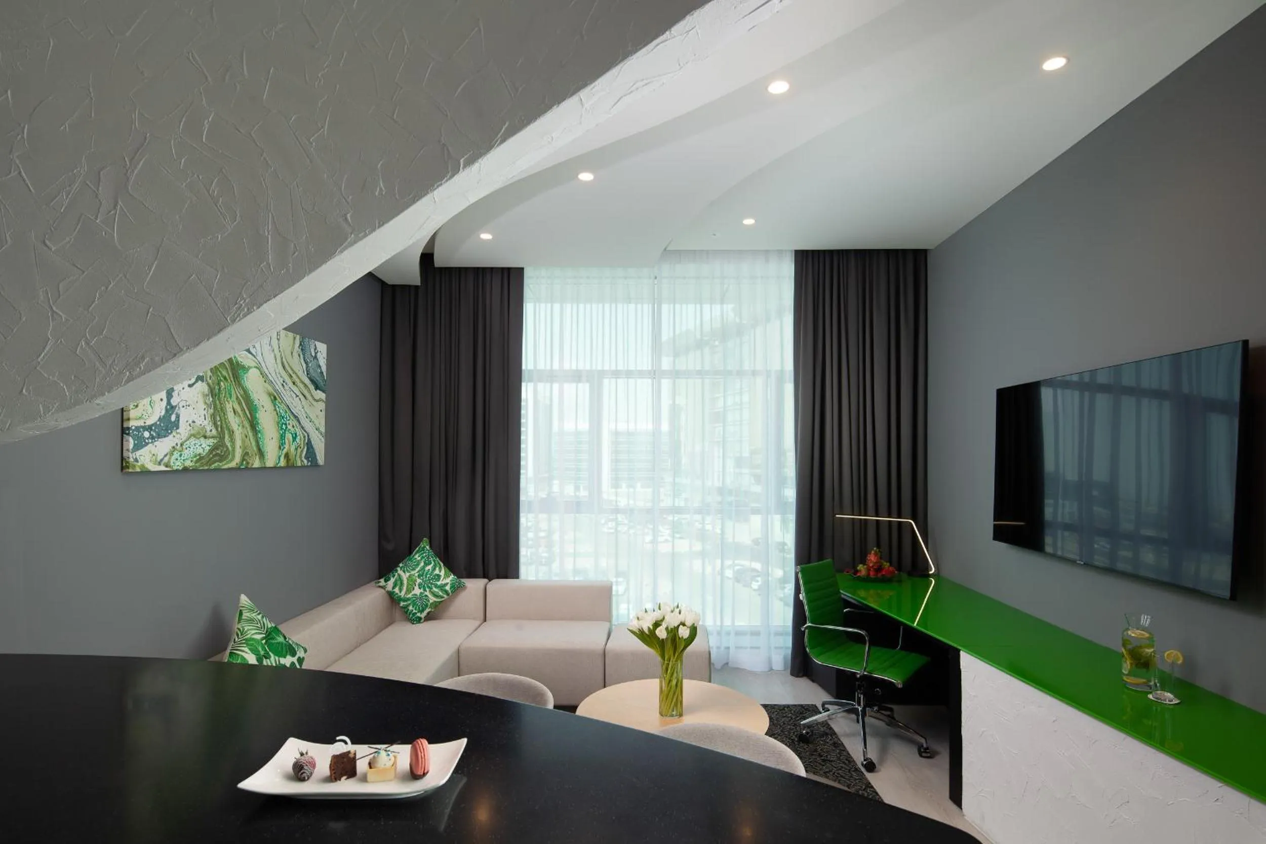 Communal lounge/ TV room in Al Khoory Sky Garden Hotel