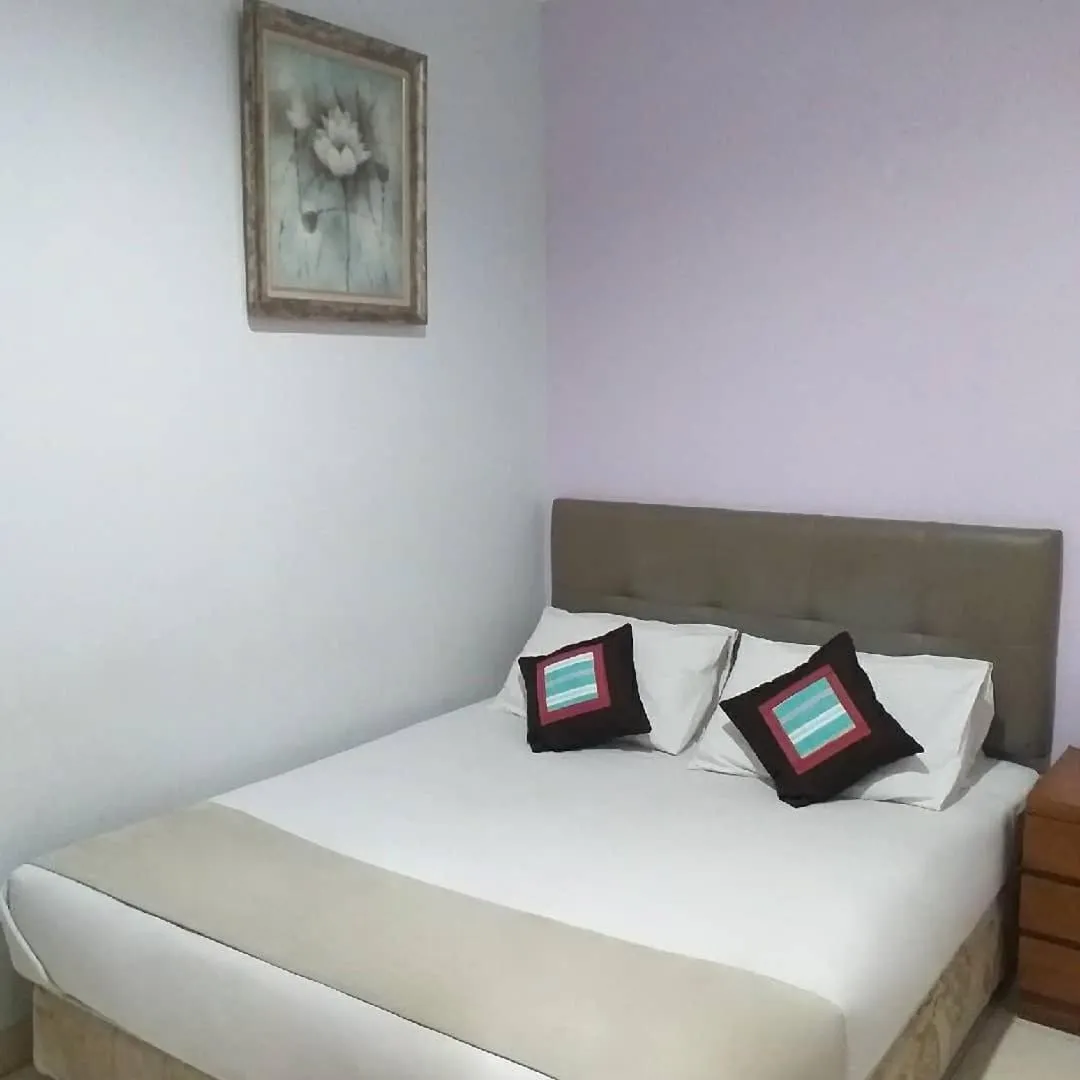 Bed in BLESSING RESIDENCE HOTEL