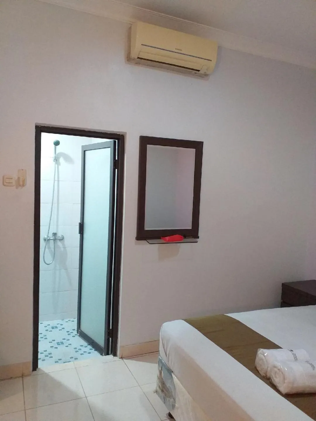 Bed in BLESSING RESIDENCE HOTEL