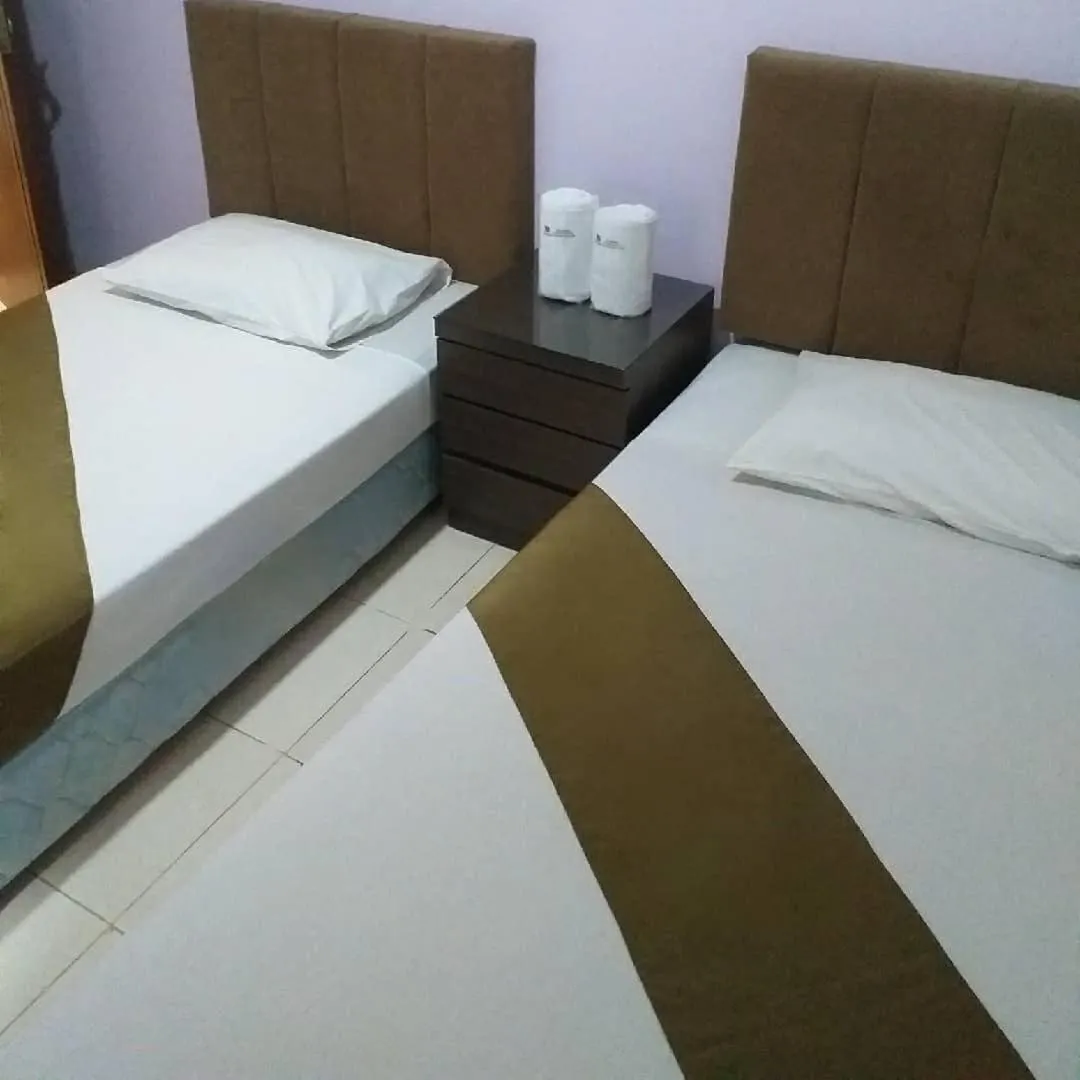 Bed in BLESSING RESIDENCE HOTEL