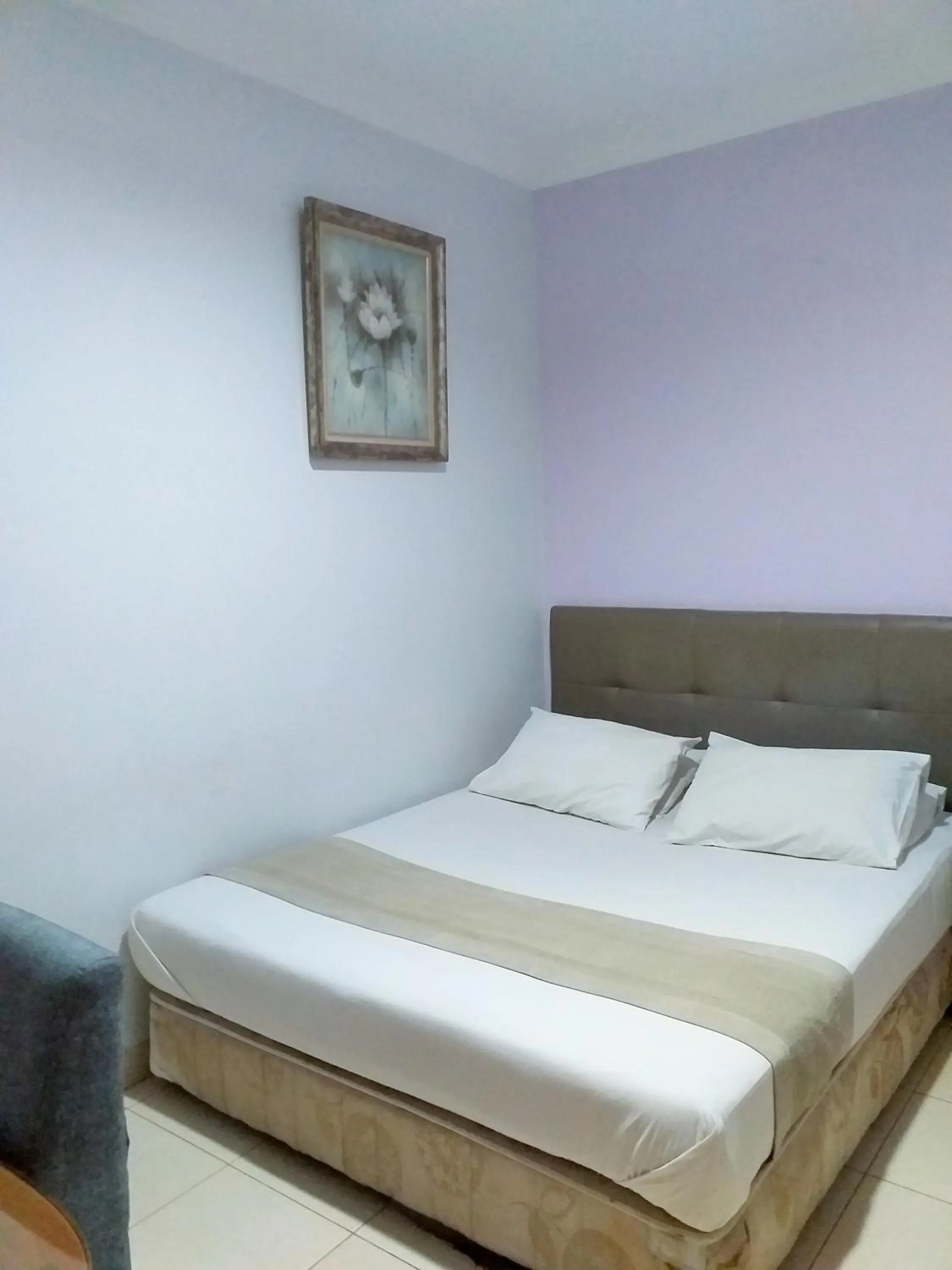 Bed in BLESSING RESIDENCE HOTEL
