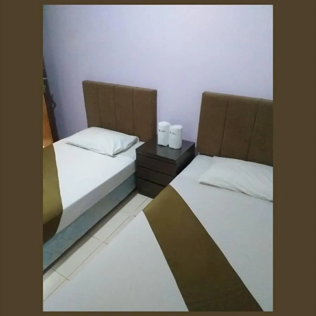 Bed in BLESSING RESIDENCE HOTEL