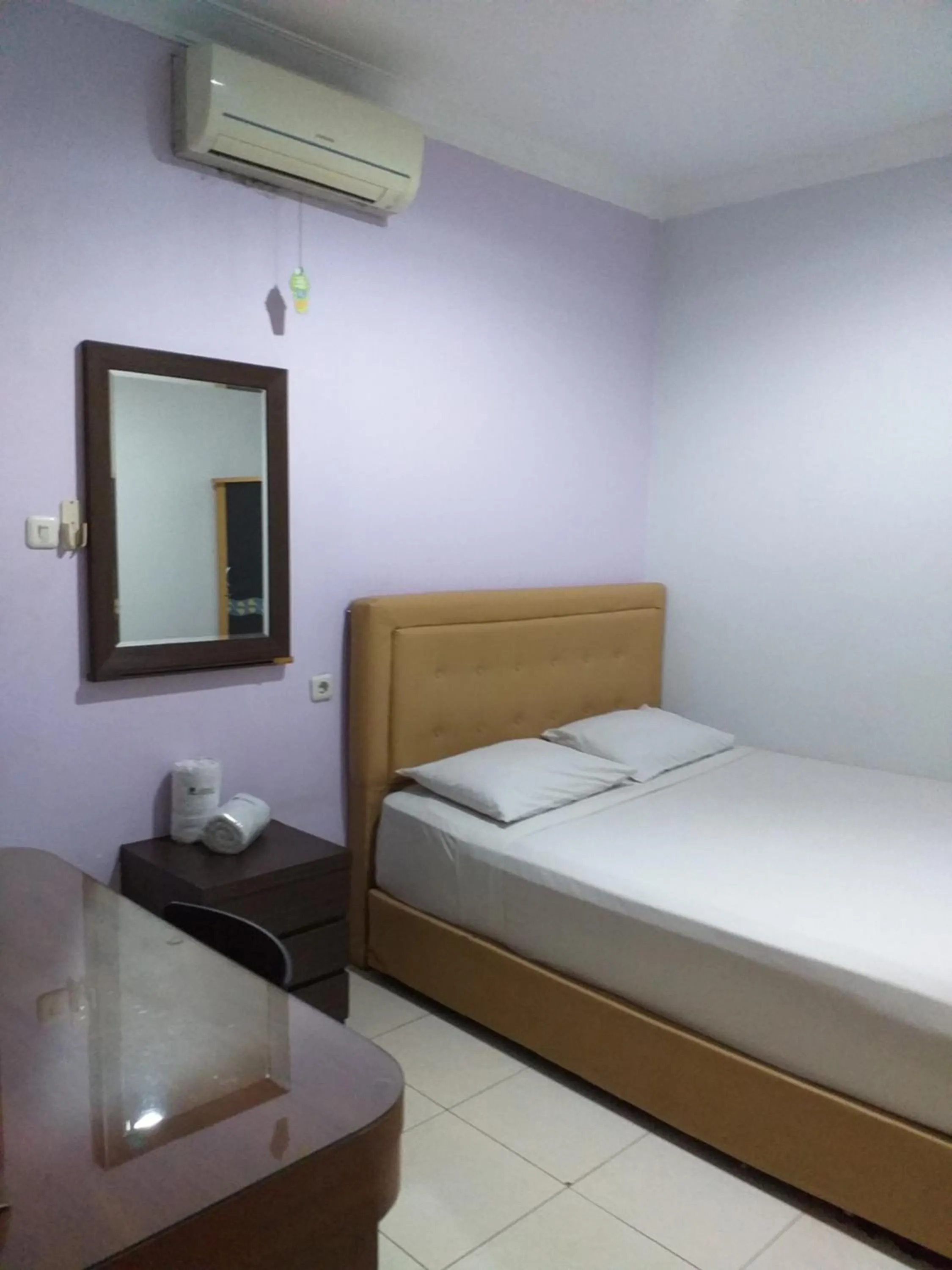 Bed in BLESSING RESIDENCE HOTEL