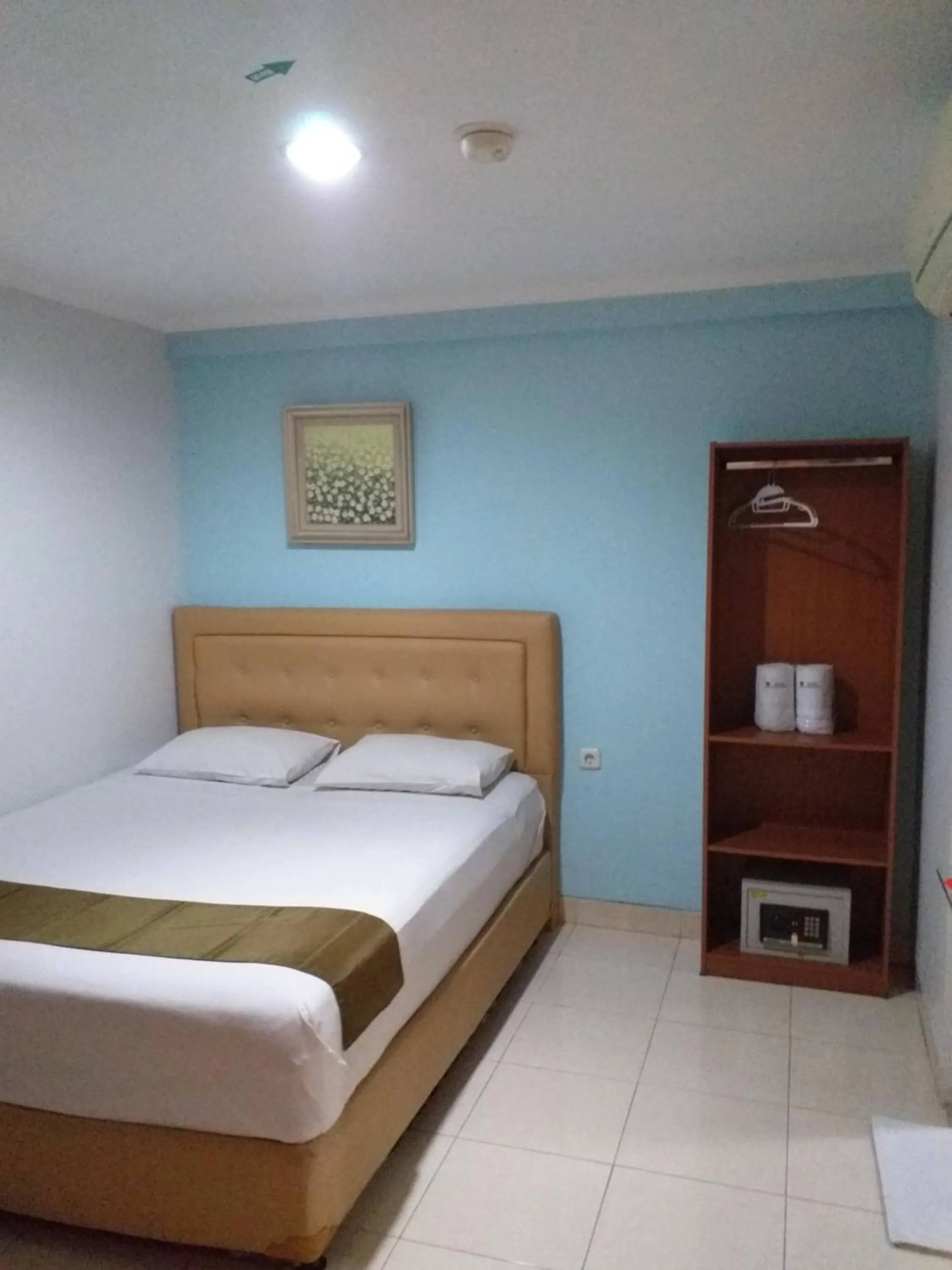 Bed in BLESSING RESIDENCE HOTEL