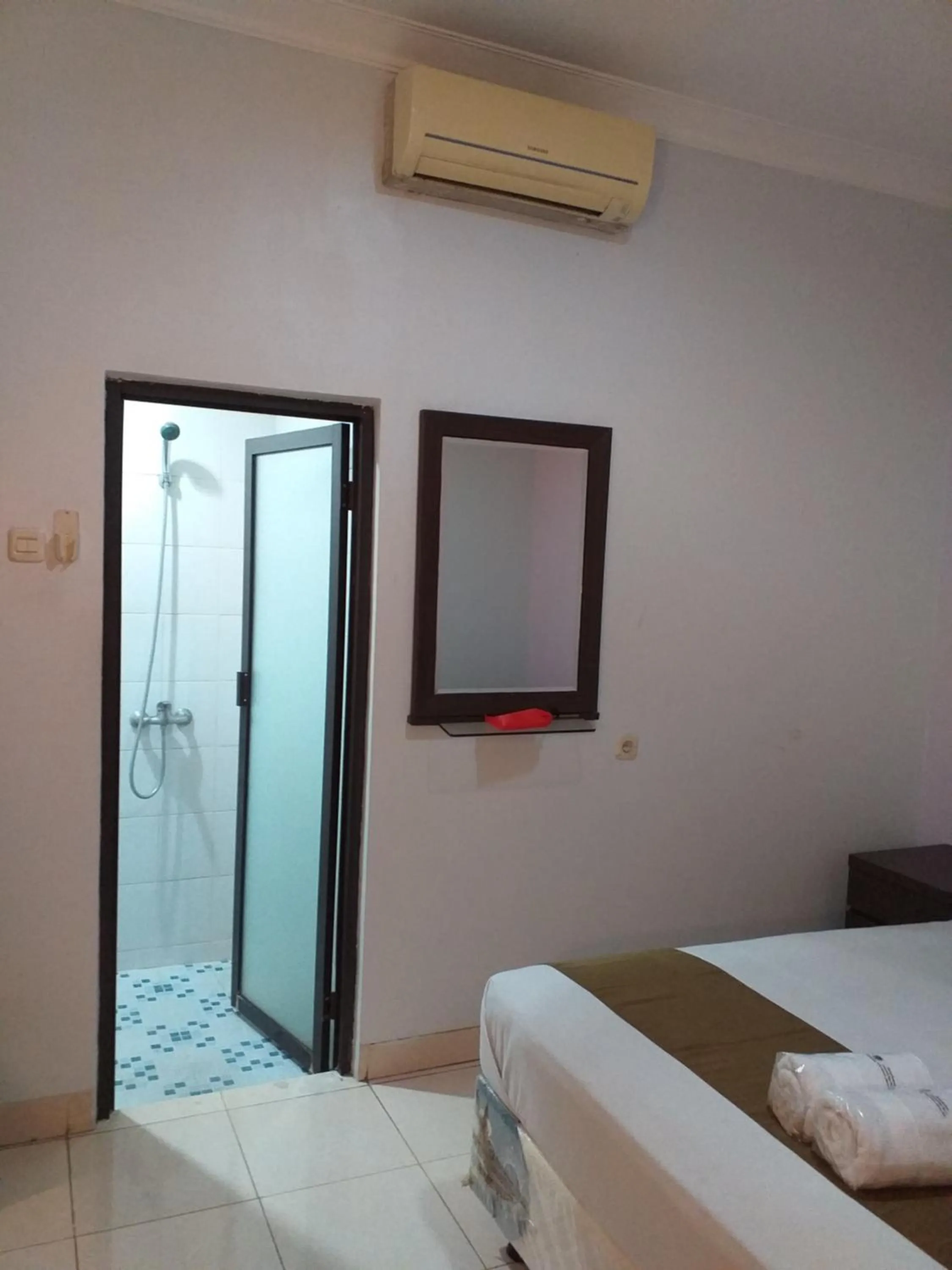 Bed in BLESSING RESIDENCE HOTEL