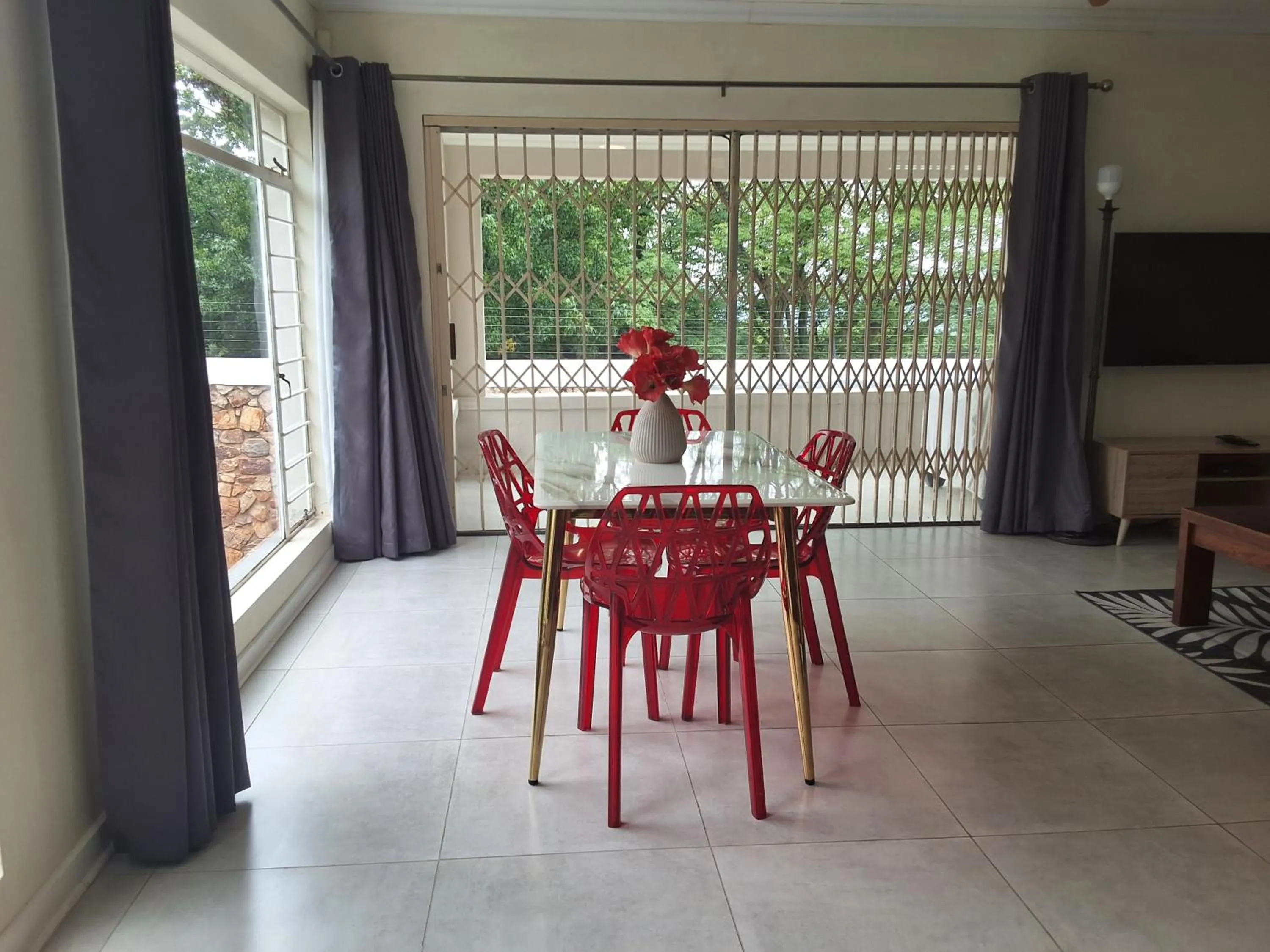 Dining area in CityView, a stunning modern apartment