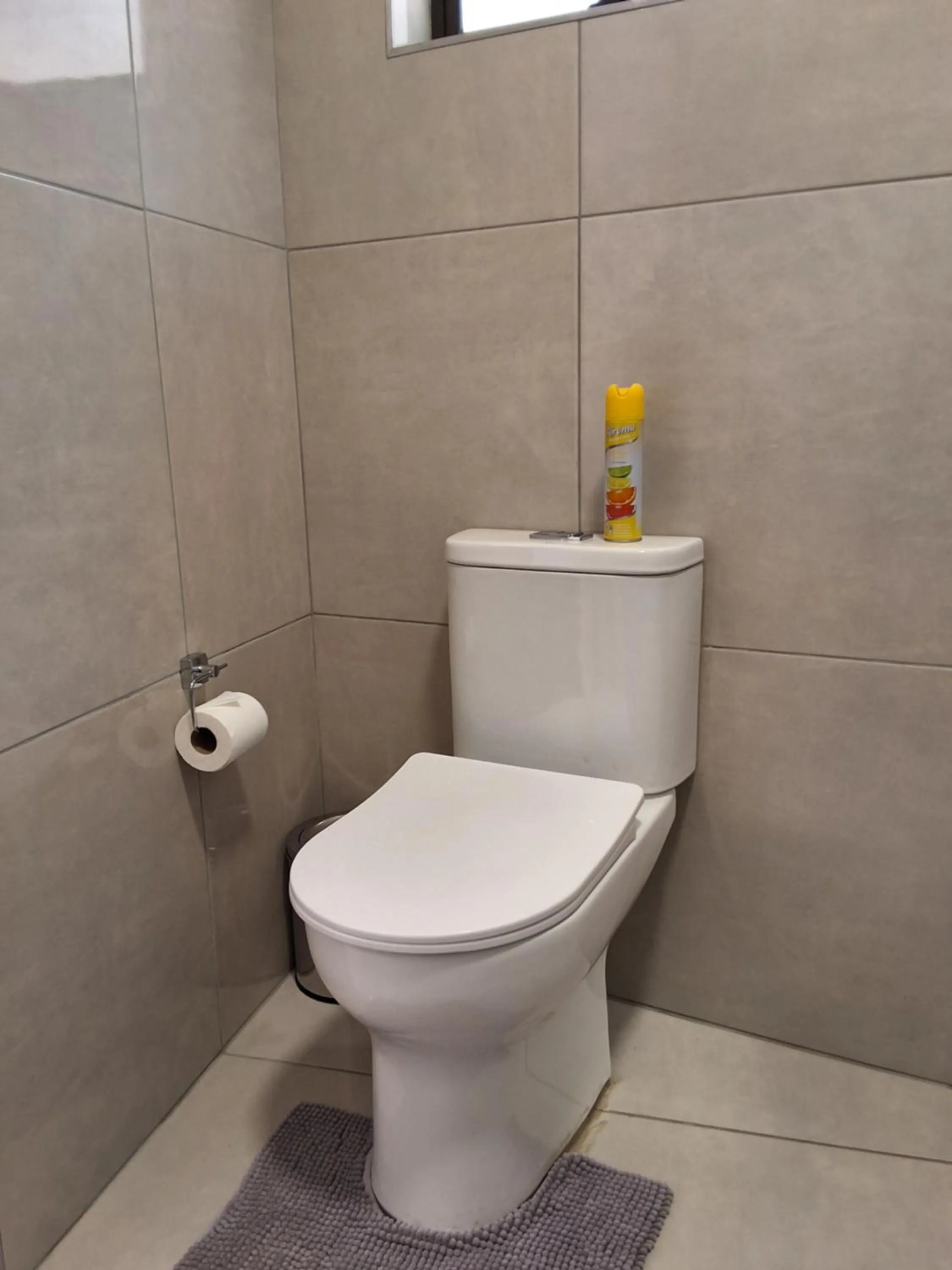 Toilet in CityView, a stunning modern apartment