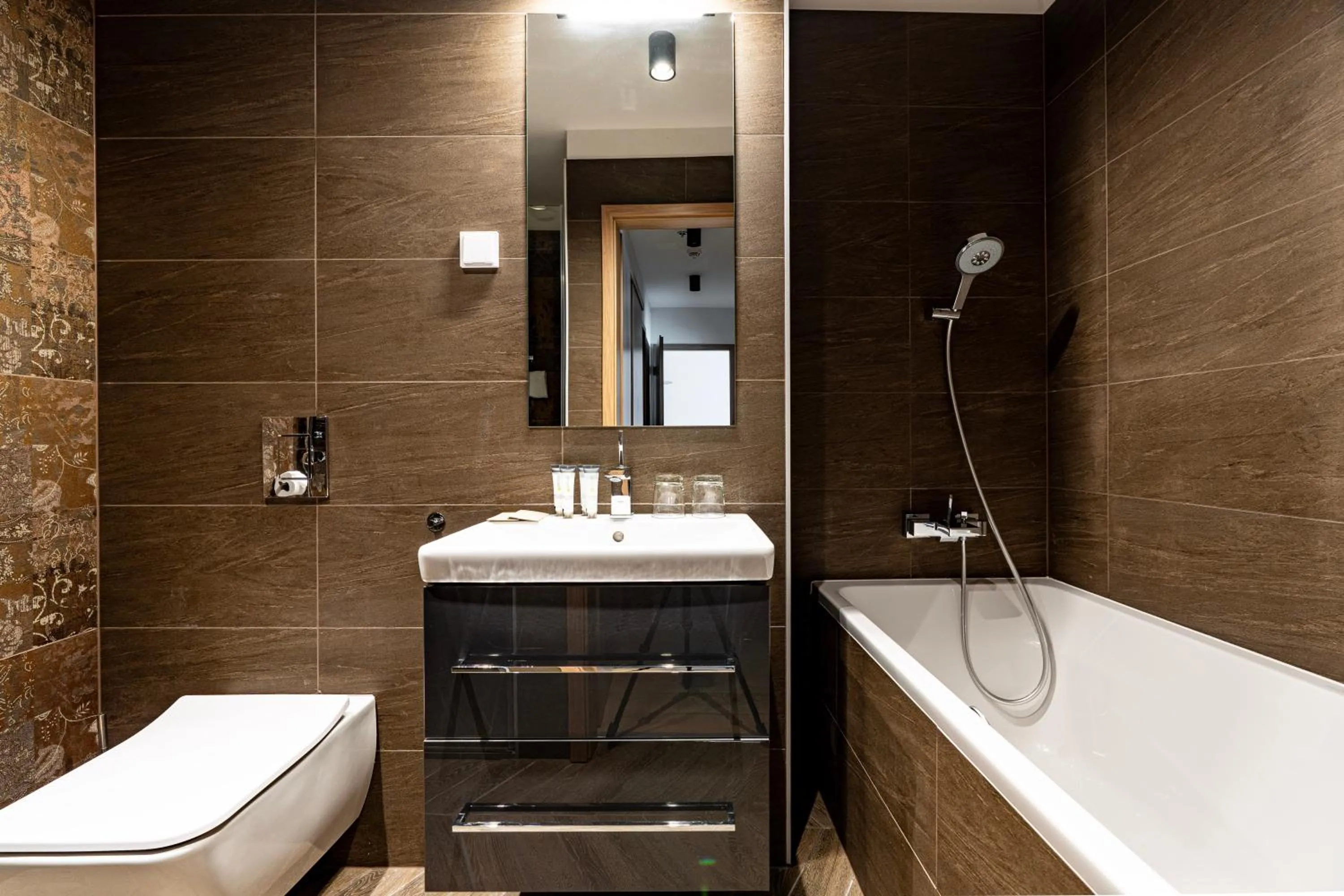 Bathroom in Emerald Downtown Luxury Suites by Continental Group