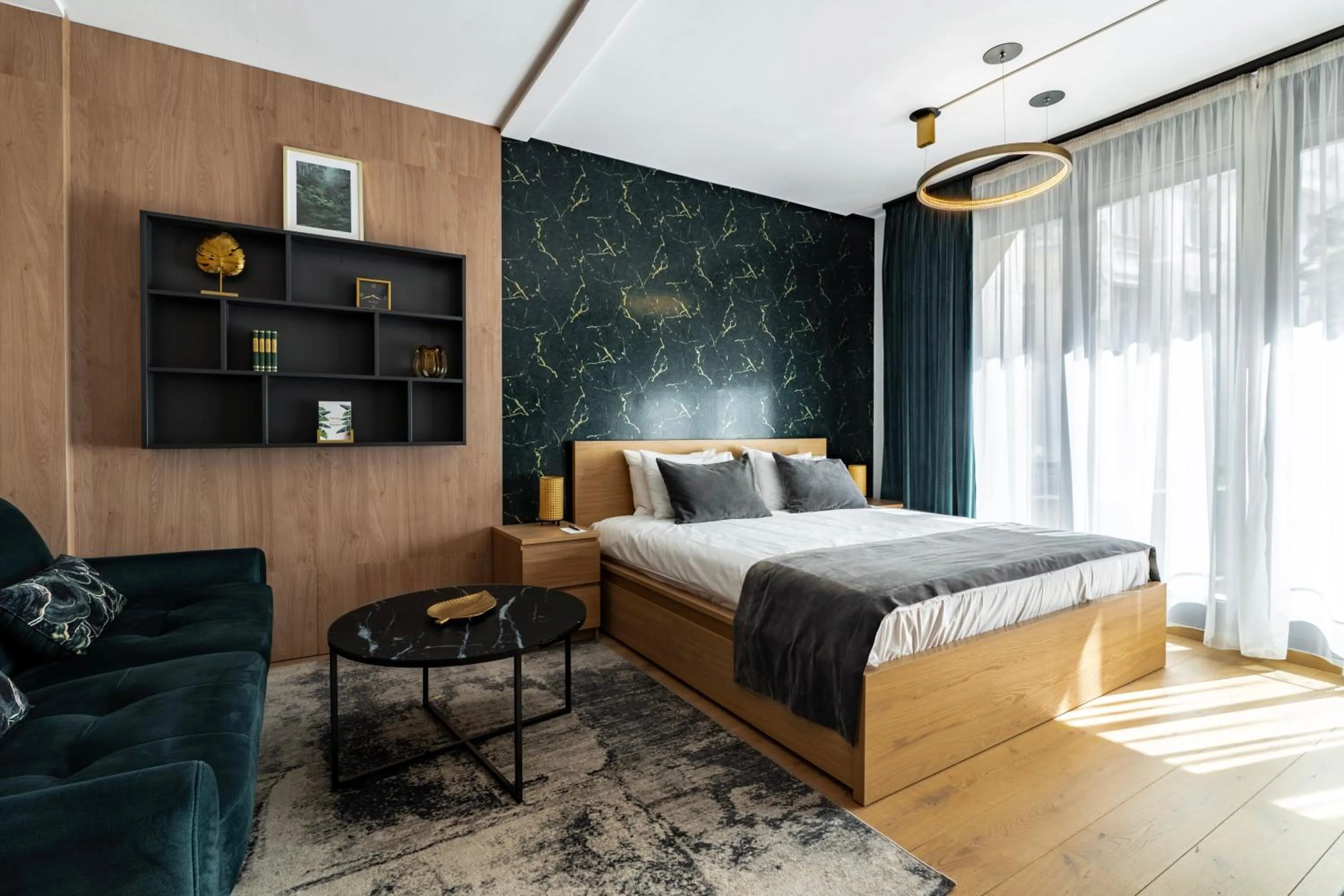 Bed in Emerald Downtown Luxury Suites by Continental Group