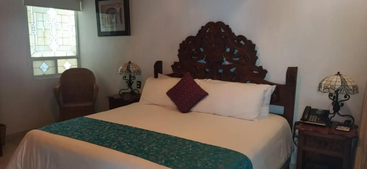 Bed in Posada de Maria Hotel Boutique & Spa