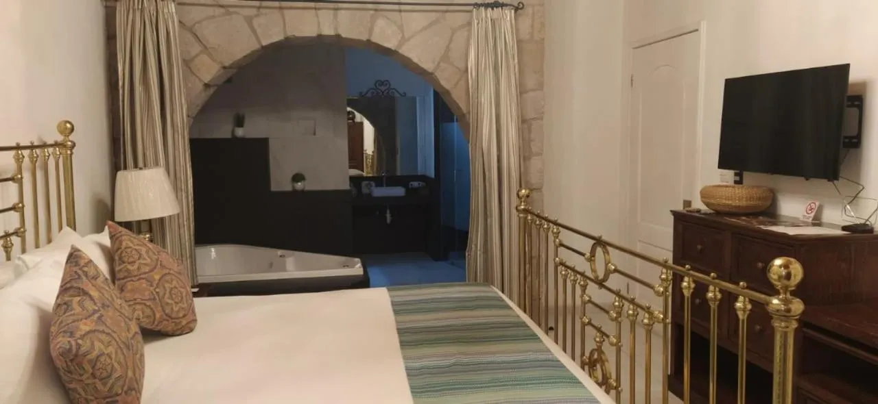 Bed in Posada de Maria Hotel Boutique & Spa