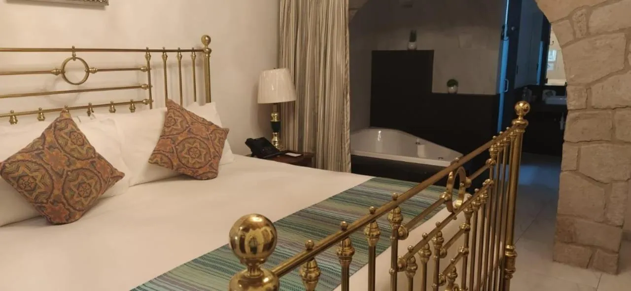 Bed in Posada de Maria Hotel Boutique & Spa