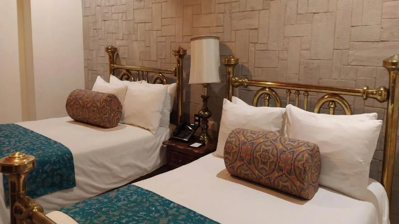 Bed in Posada de Maria Hotel Boutique & Spa