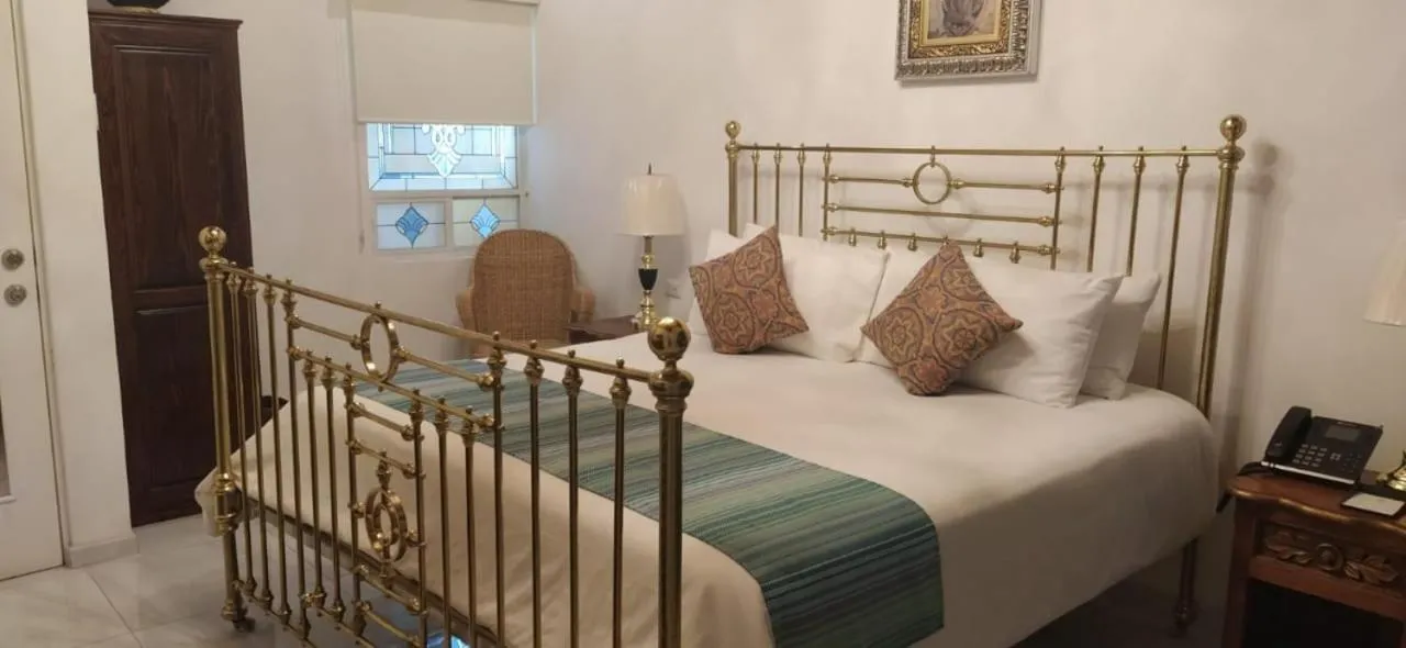 Bed in Posada de Maria Hotel Boutique & Spa