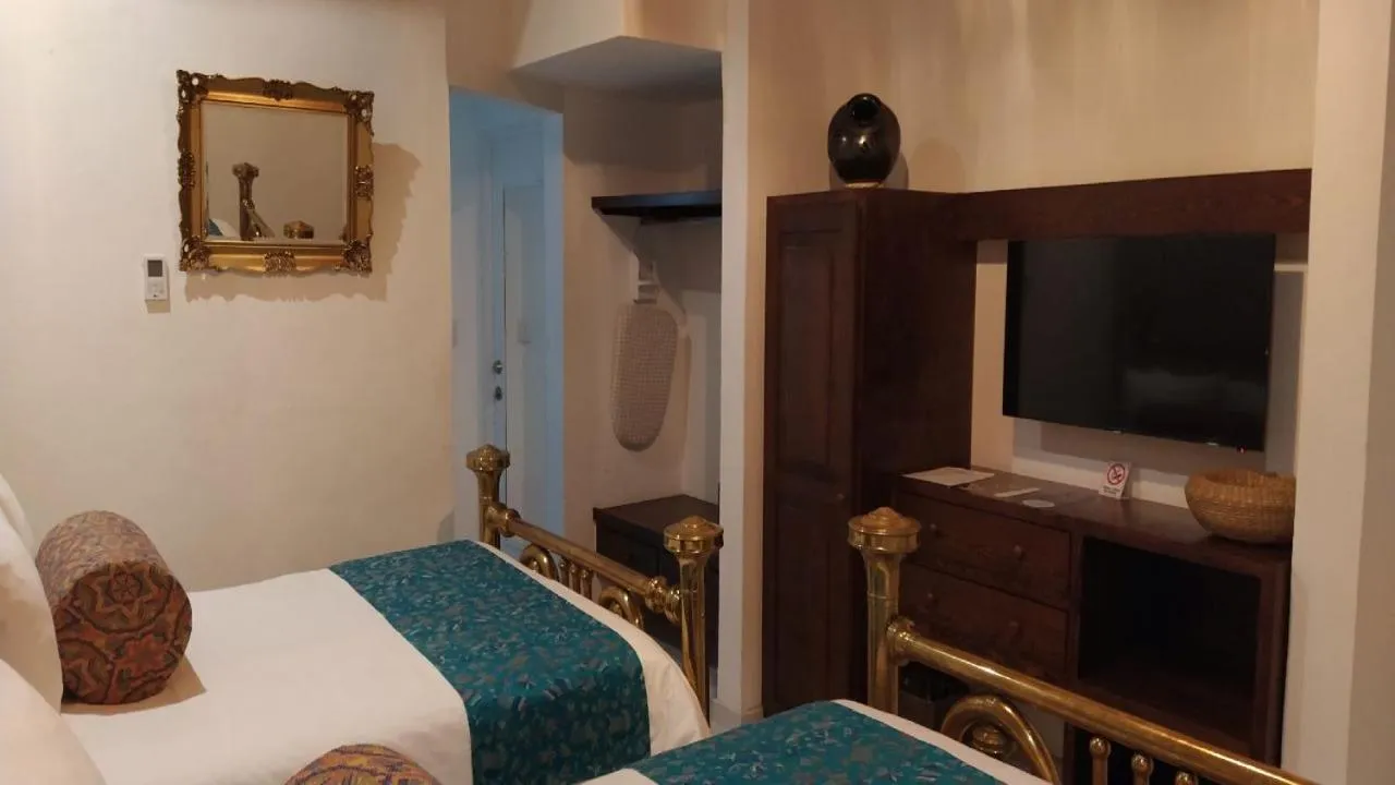 Bed in Posada de Maria Hotel Boutique & Spa