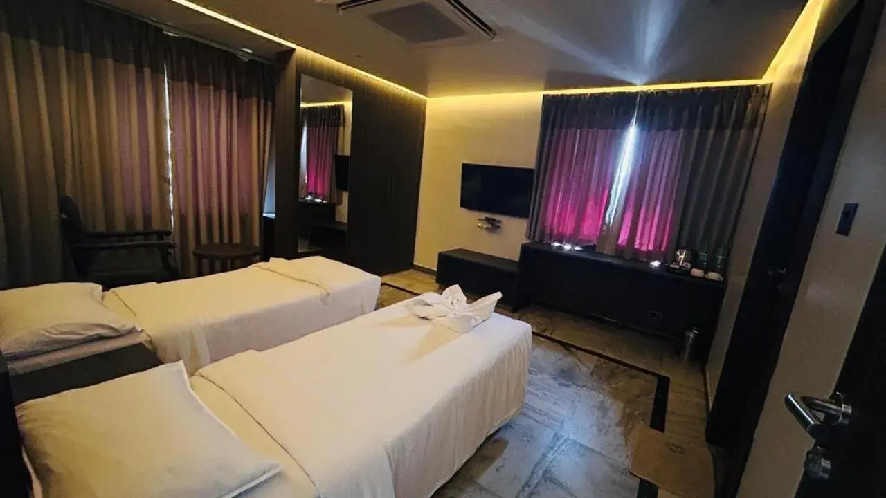 Bed in Ariya Nivaas A Vegetarian Hotel Bed in Ariya Nivaas A Vegetarian Hotel