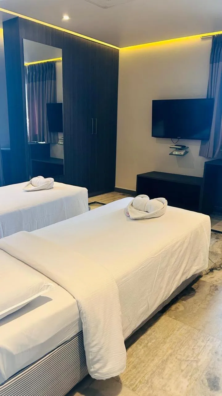 Bed in Ariya Nivaas A Vegetarian Hotel