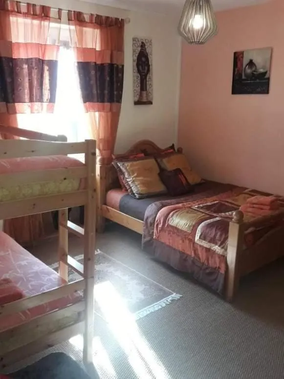 Bed in Sunset House Chambres de Hotes