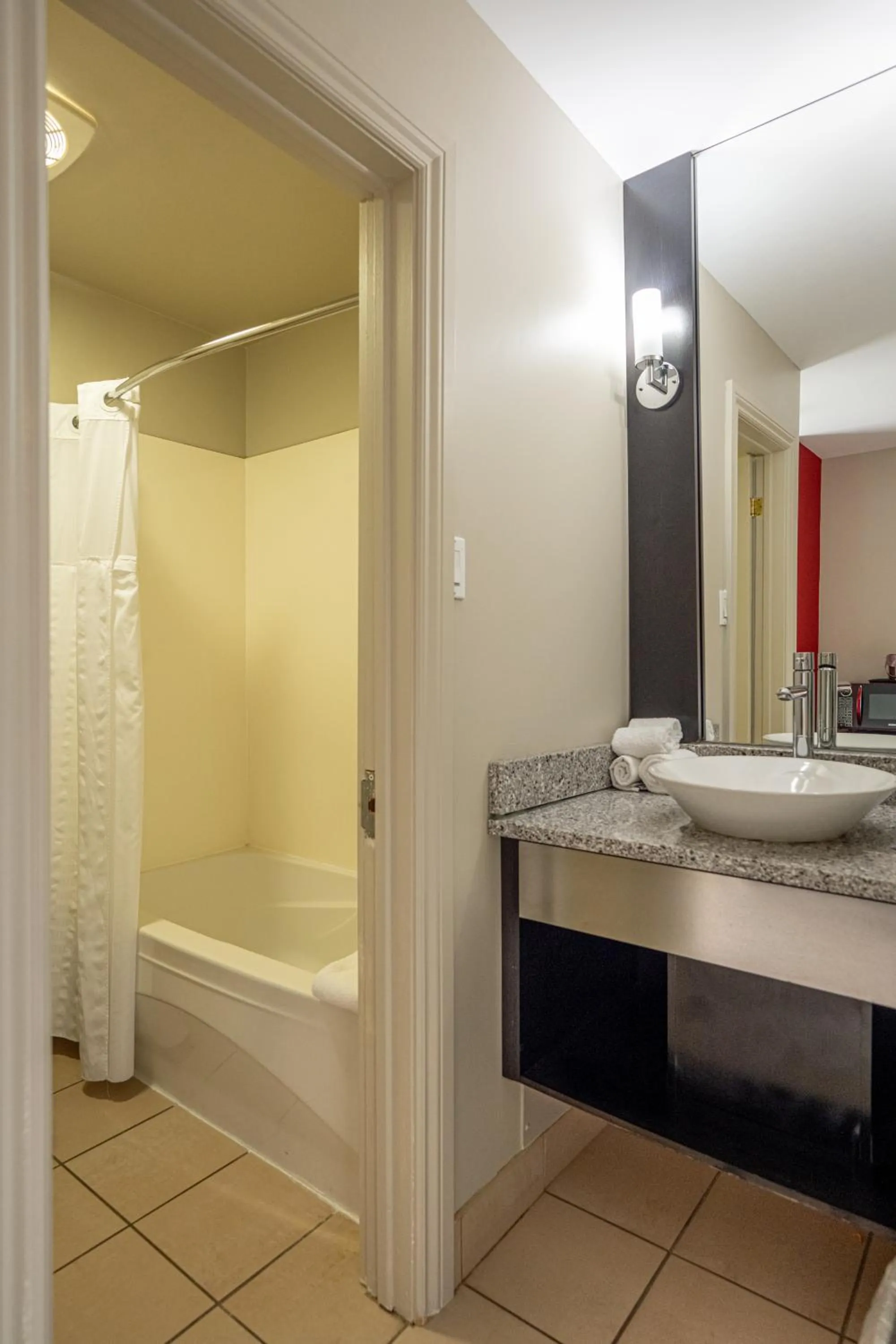 Bathroom in Ramada by Wyndham Ottawa On The Rideau
