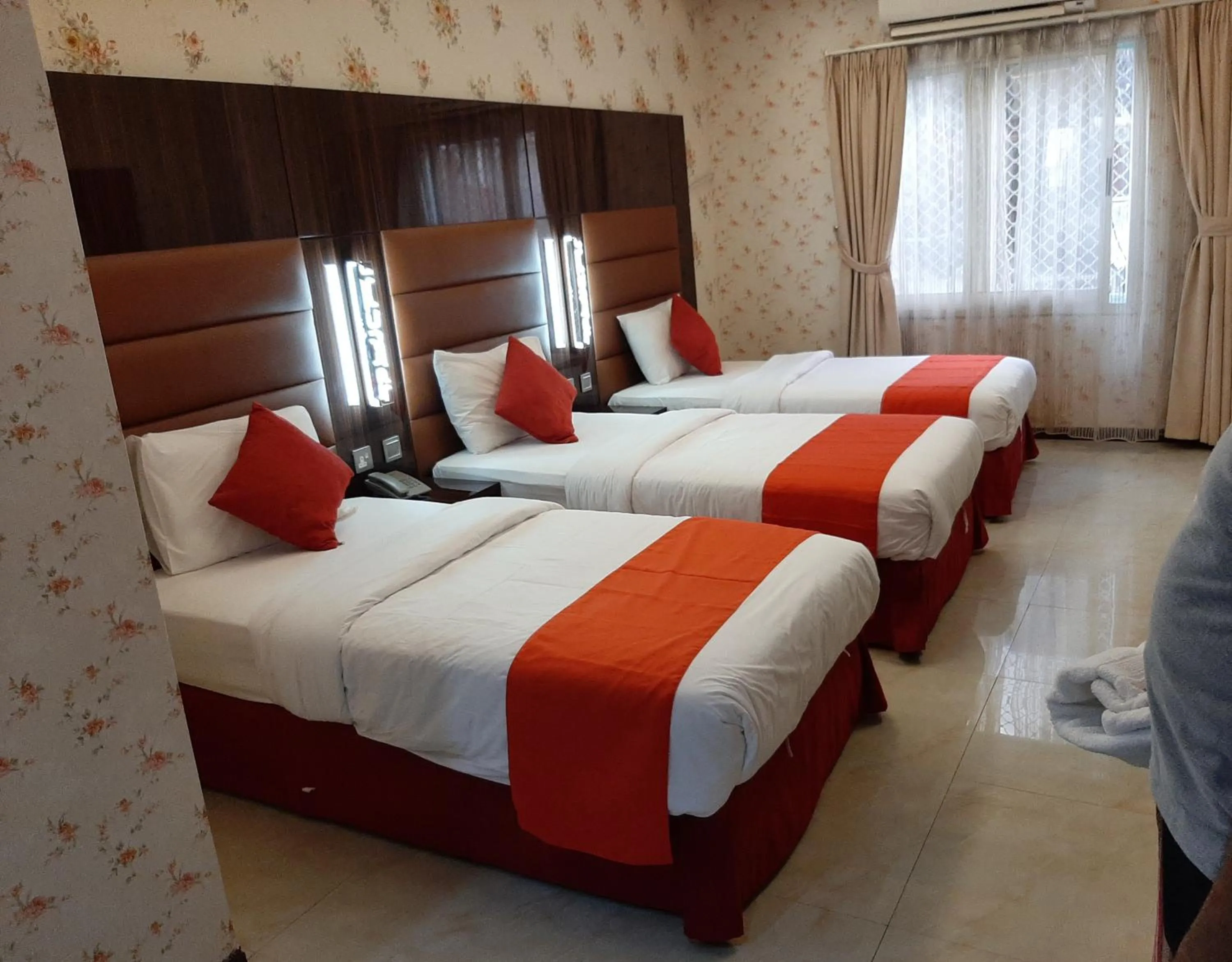 Bed in BURJ NAHAR HOTEL L.L.C