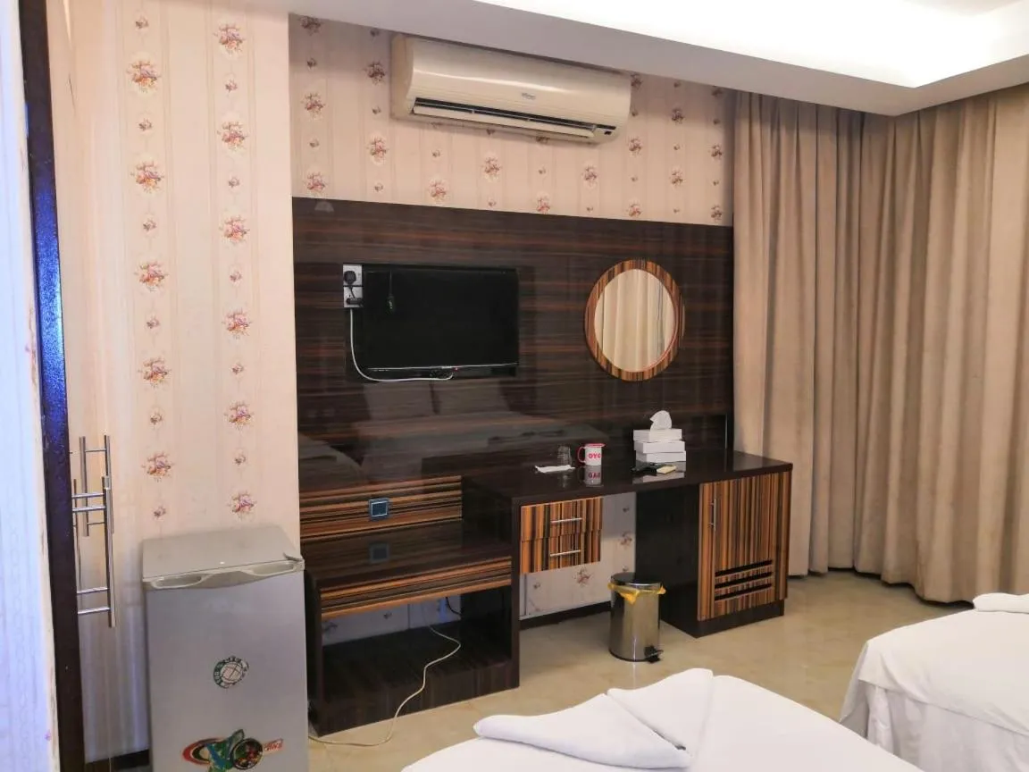 Bed in BURJ NAHAR HOTEL L.L.C