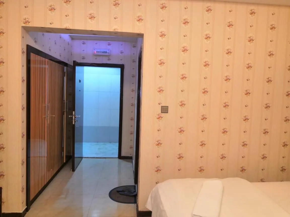 Bed in BURJ NAHAR HOTEL L.L.C