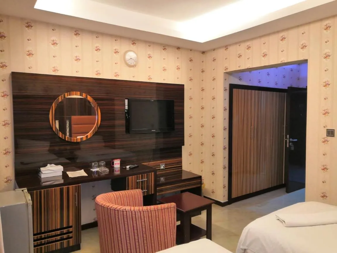 Bed in BURJ NAHAR HOTEL L.L.C