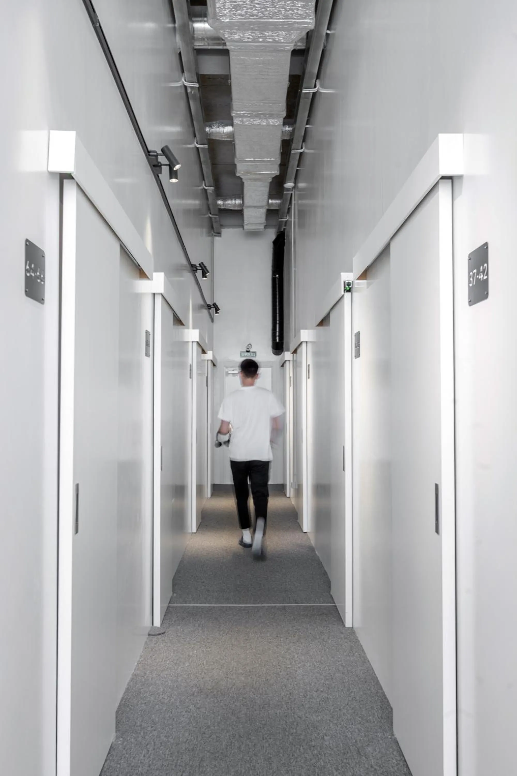 People in Capsule Hotel Constellation 89