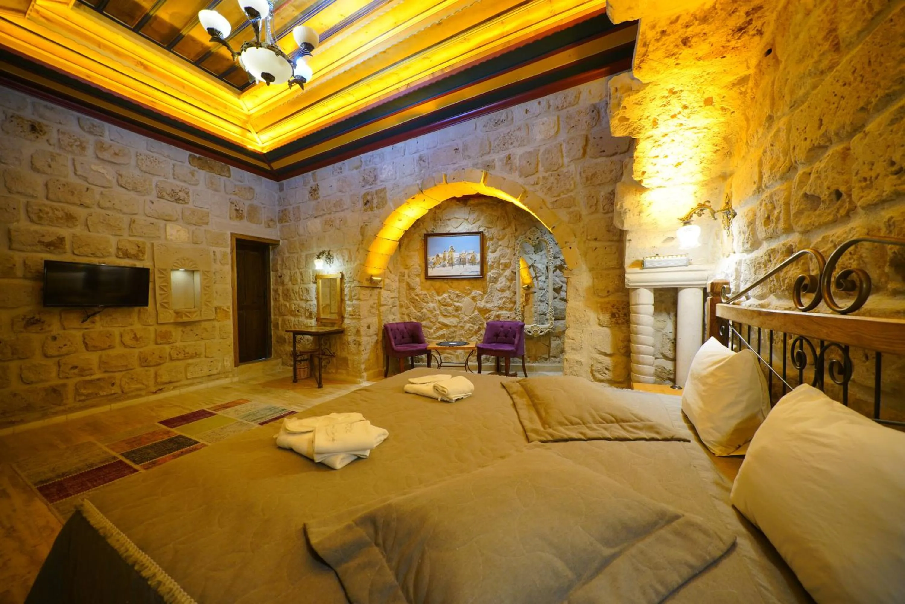 Bed in Göreme Cave Lodge