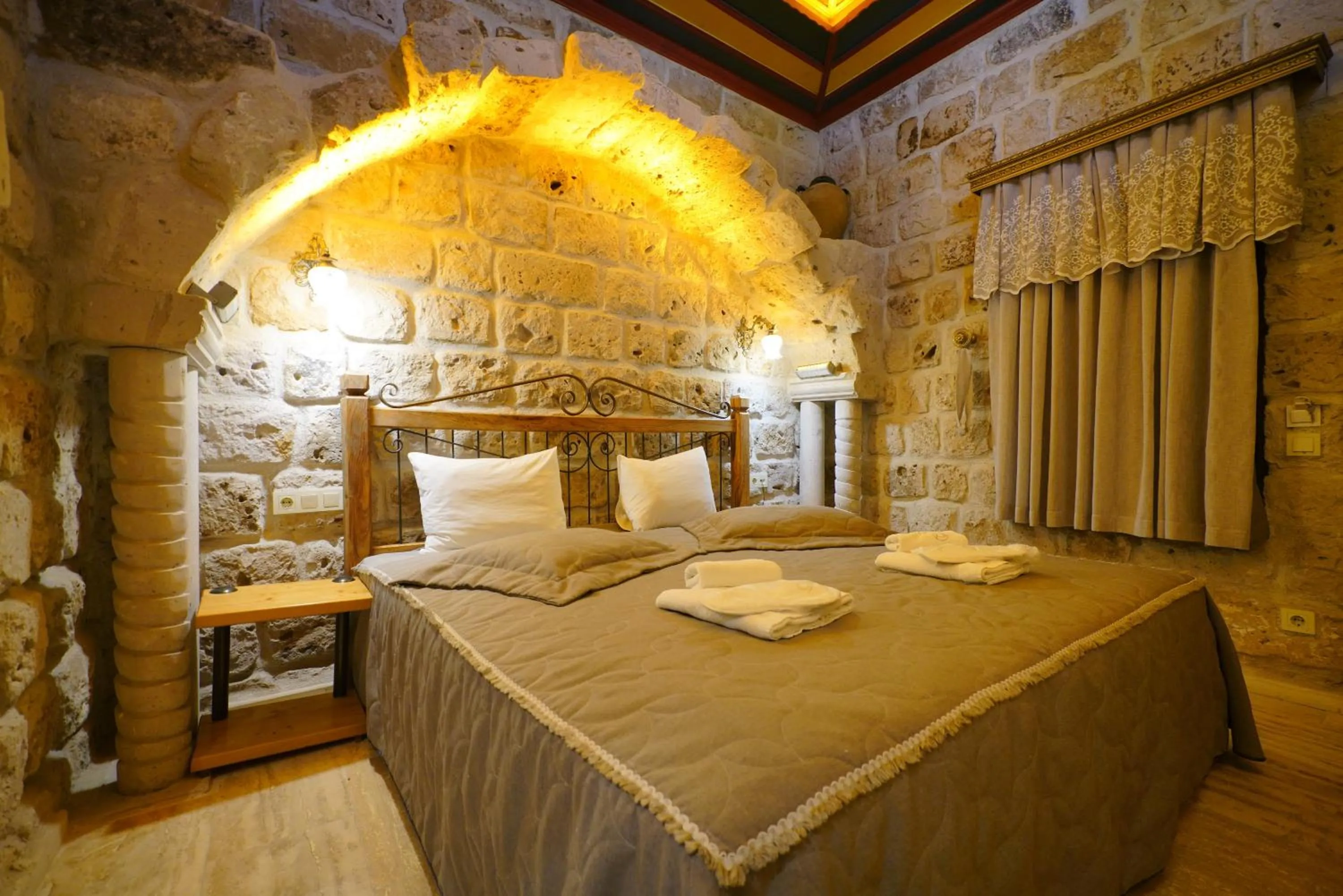 Bed in Göreme Cave Lodge