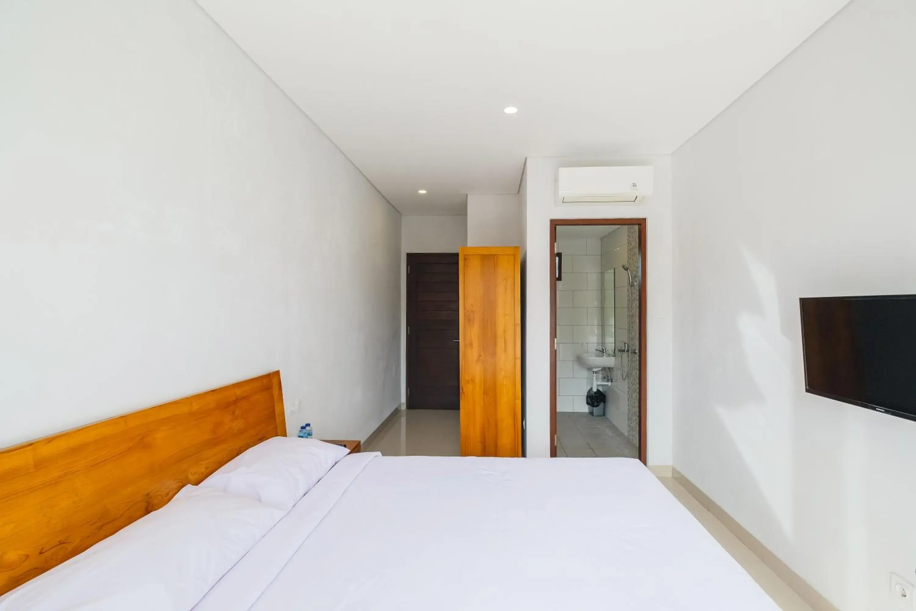 Bedroom, Bed in Dharma Guest House Seminyak RedPartner Bedroom, Bed in Dharma Guest House Seminyak RedPartner