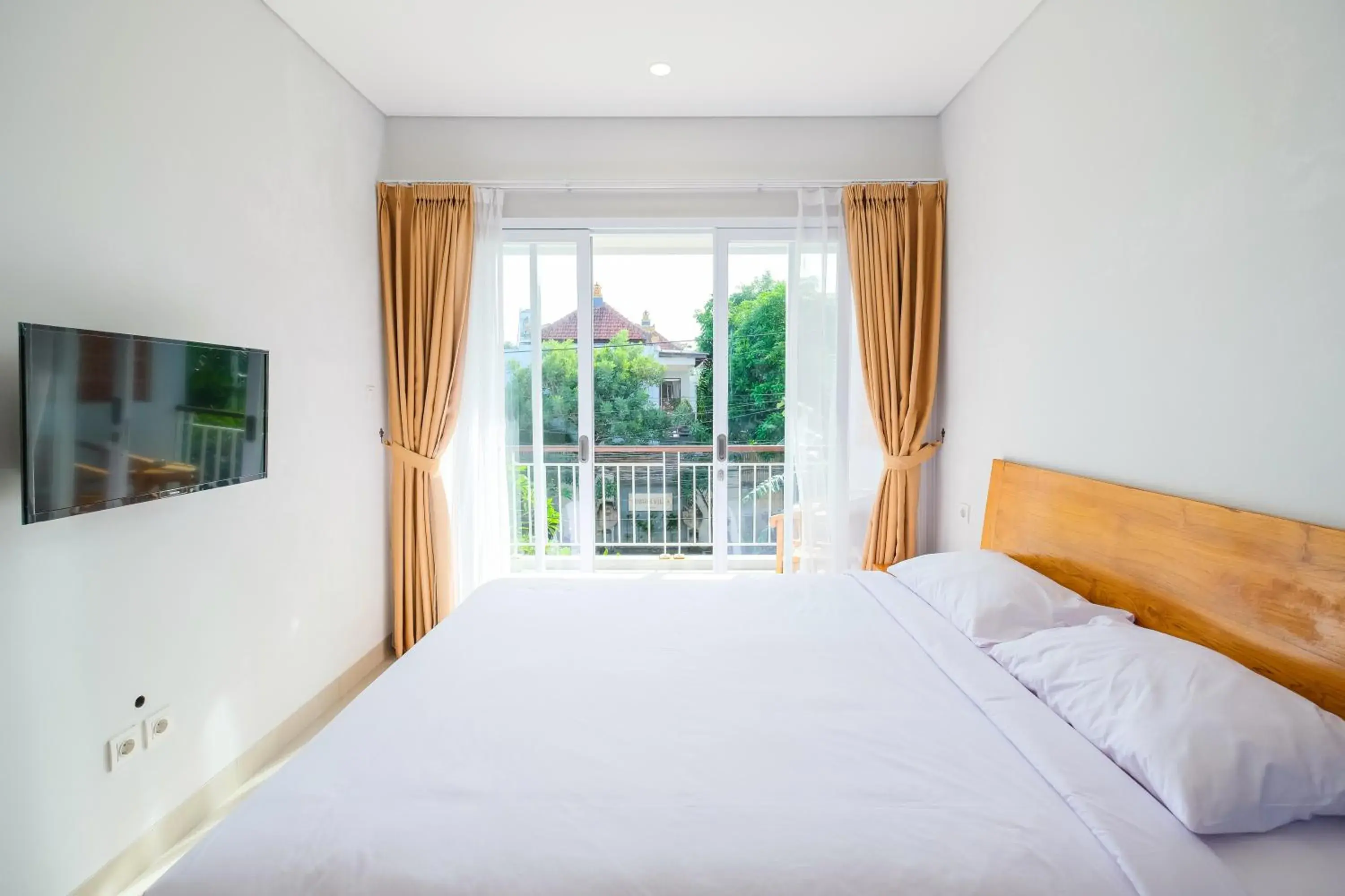 Bedroom, Bed in Dharma Guest House Seminyak RedPartner Bedroom, Bed in Dharma Guest House Seminyak RedPartner