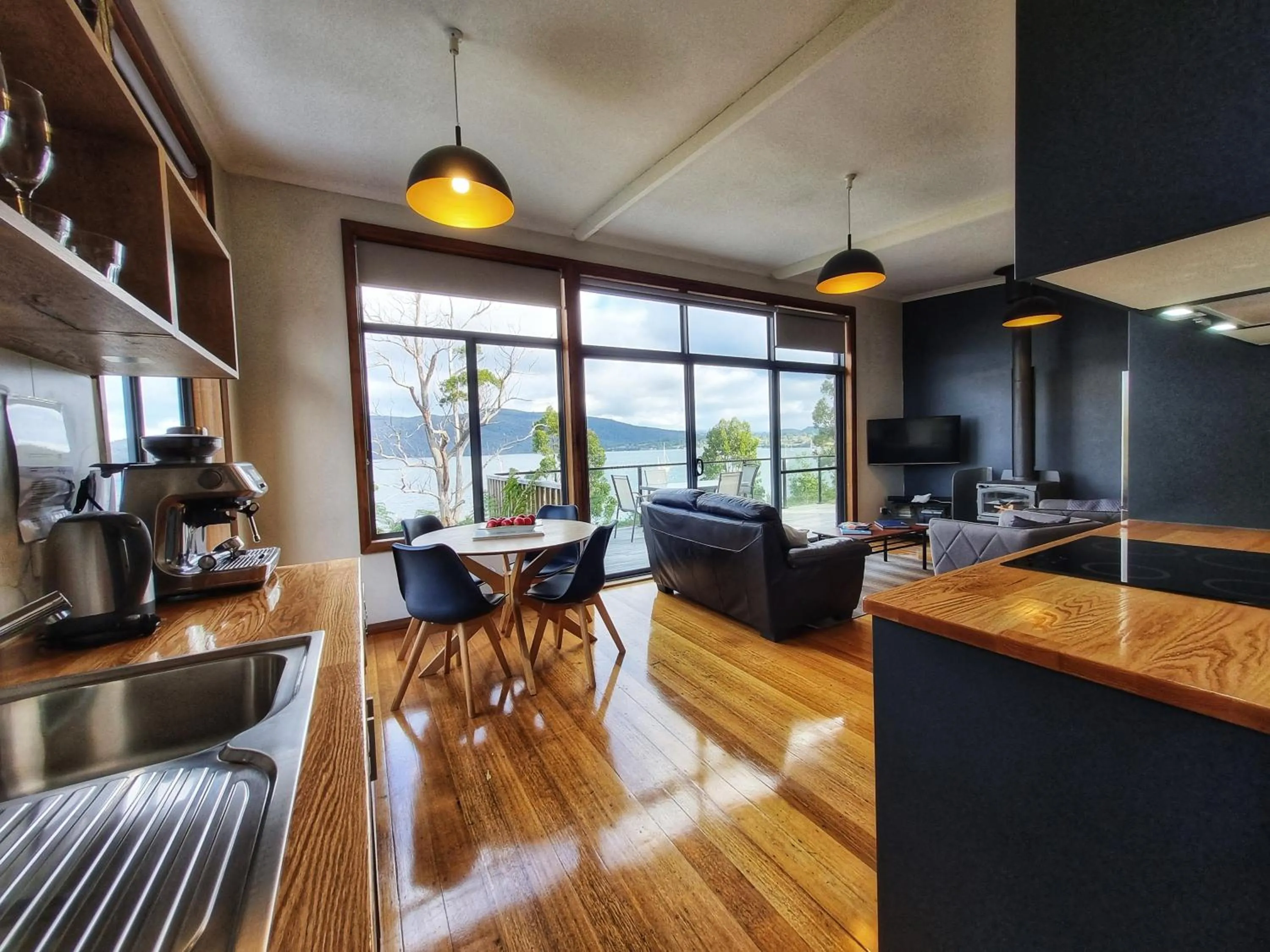 Kitchen or kitchenette in The Beach House- private jacuzzi and wood fire!