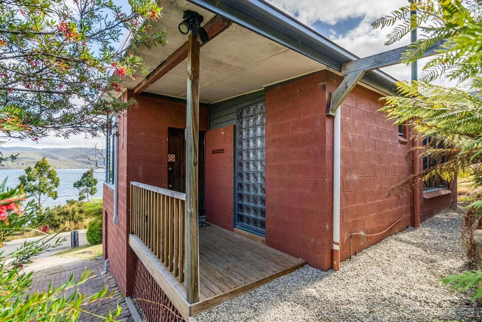 Property building in The Beach House- private jacuzzi and wood fire!