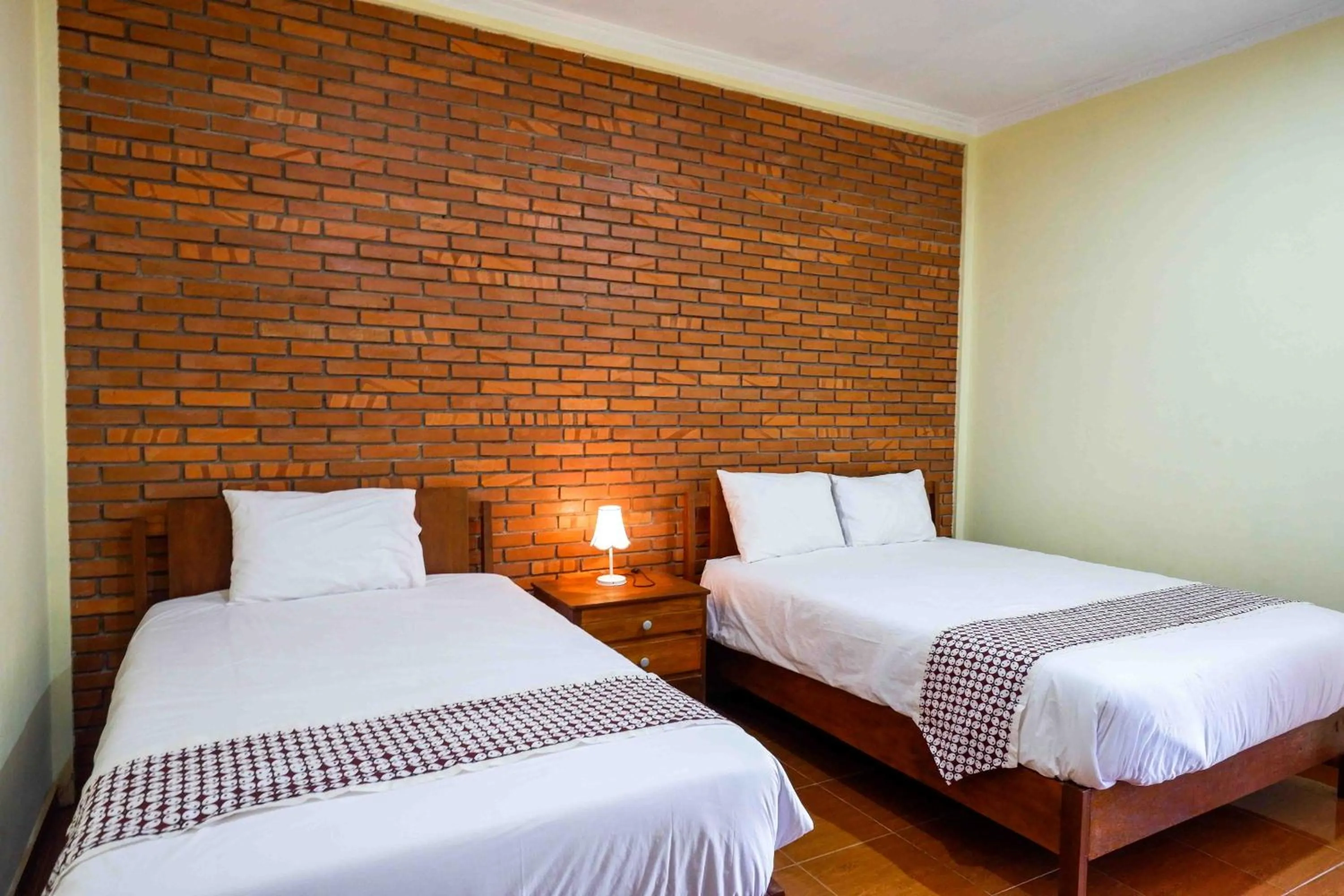 Bed in Roemah Beong Syariah at Desa Wisata Kembanglimus Mitra RedDoorz